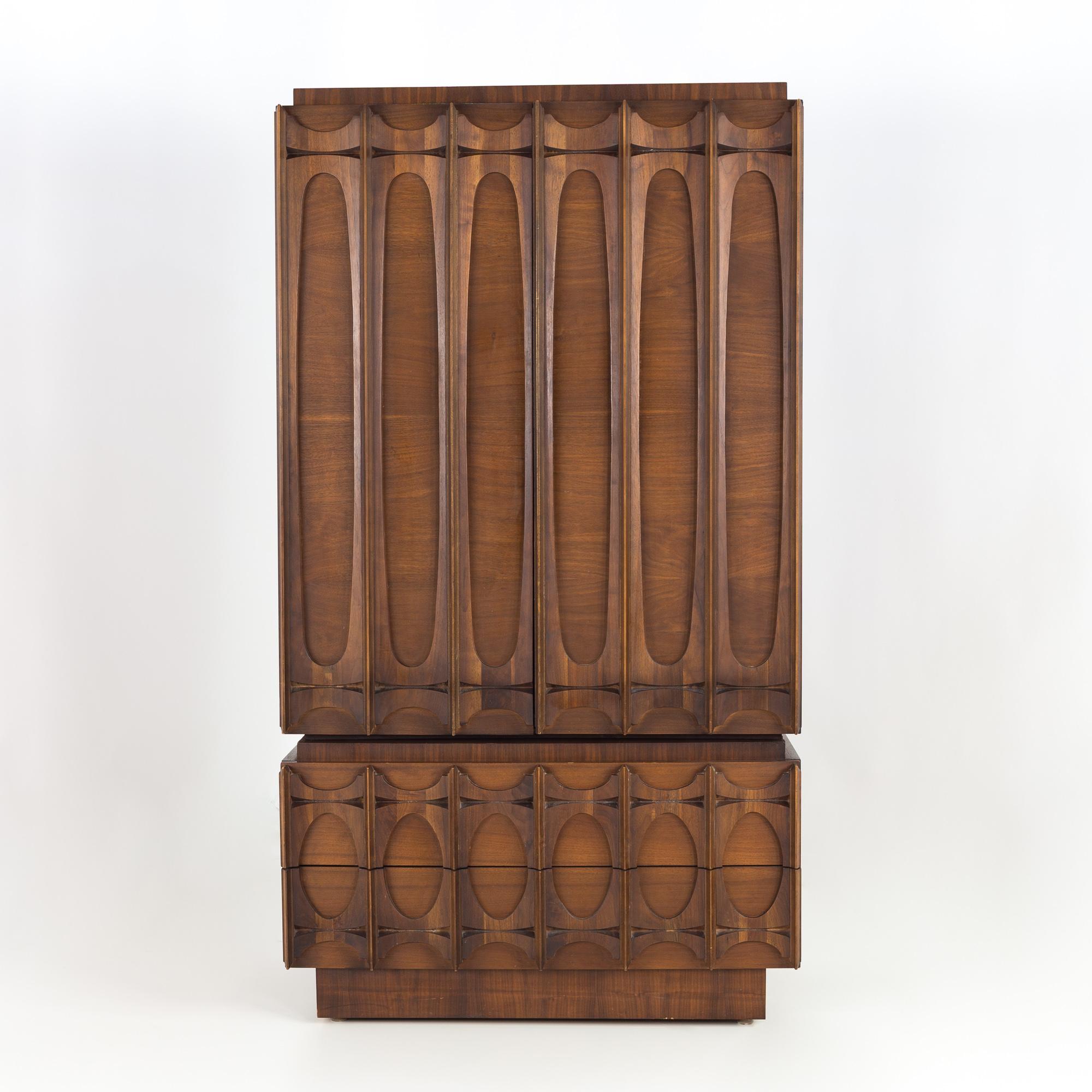 Tobago Canadian Brutalist mid century 2 piece gentlemans chest armoire highboy dresser

This armoire measures: 40 wide x 21.5 deep x 73 inches high

All pieces of furniture can be had in what we call restored vintage condition. That means the