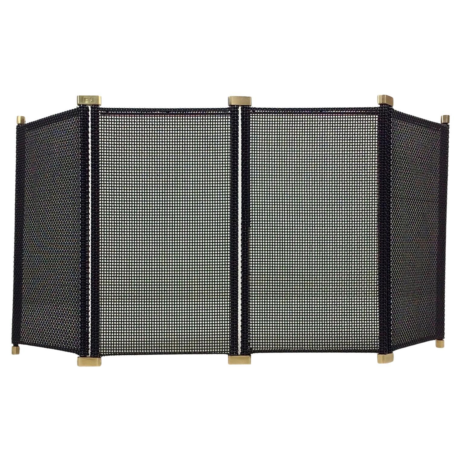 Afra and Tobia Scarpa adjustable fireplace screen for Dimensione Fuoco, circa 1970, Italy.
Black metal folding and adjustable fireplace screen with three sections and brass details.
Dimensions: 4 panels, each one is 24 W x 45 H, maximum extension: