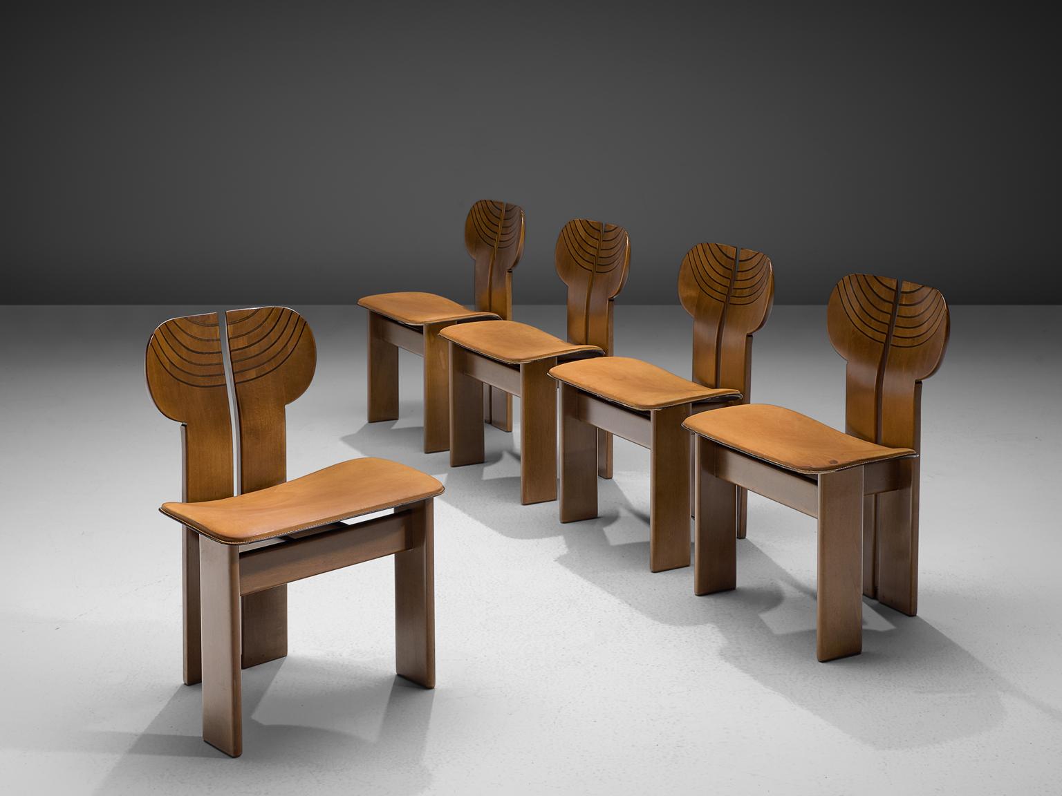 Afra & Tobia Scarpa, five dining chairs, cognac leather, walnut, ebony and brass, Maxalto, Italy, 1975.

This set of chairs explicitly sculptural grand chairs are by Afra & Tobia Scarpa and are titled 'Africa' and are part of the Artona collection