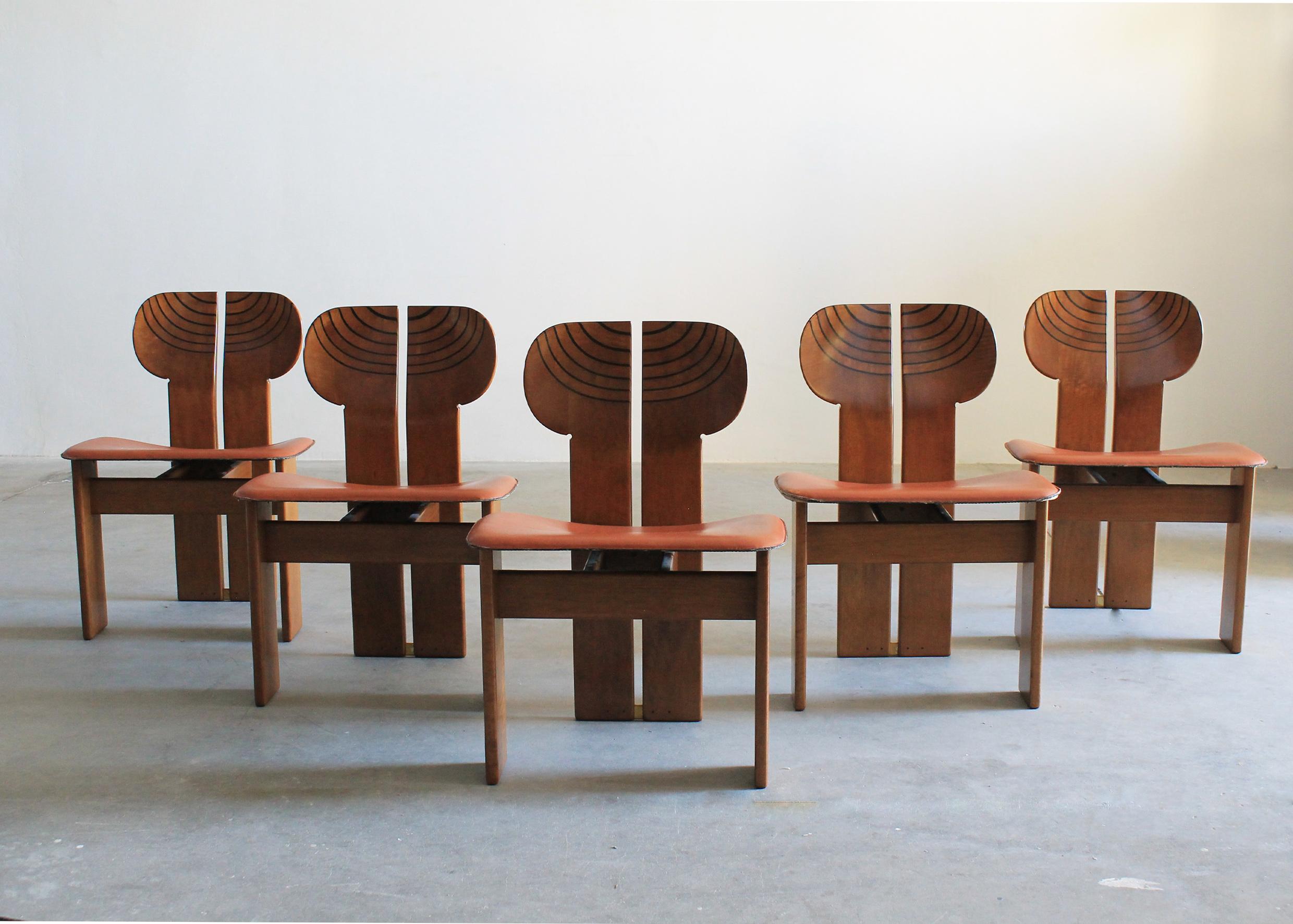 Set of five Africa chairs with a structure in walnut wood and burl, seats upholstered with beautiful high-quality leather and brass details. 

These unique sculptural chairs were designed by Tobia and Afra Scarpa, and they are part of the Artona