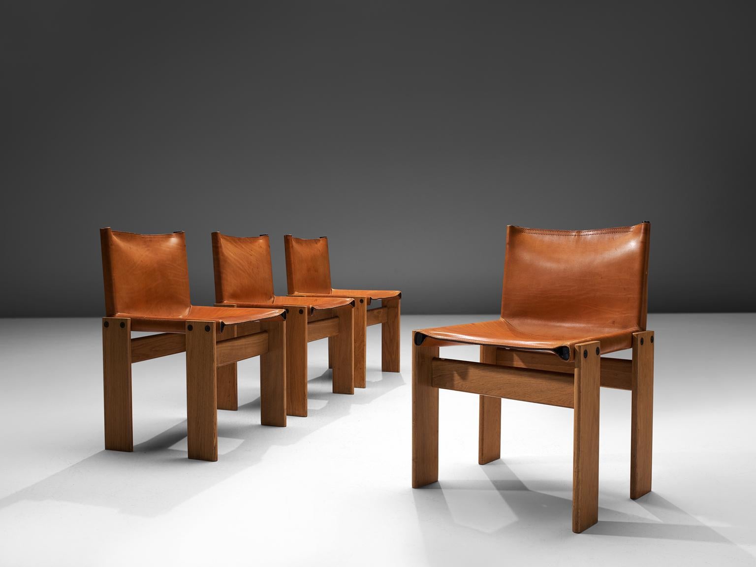 Afra & Tobia Scarpa for Molteni, Monk set of Four dining chairs, patinated beech and cognac leather, Italy, 1974.

The wonderfully cognac leather forms a striking combination with the blond wood. Interesting is the 'flat' shape of this chair where