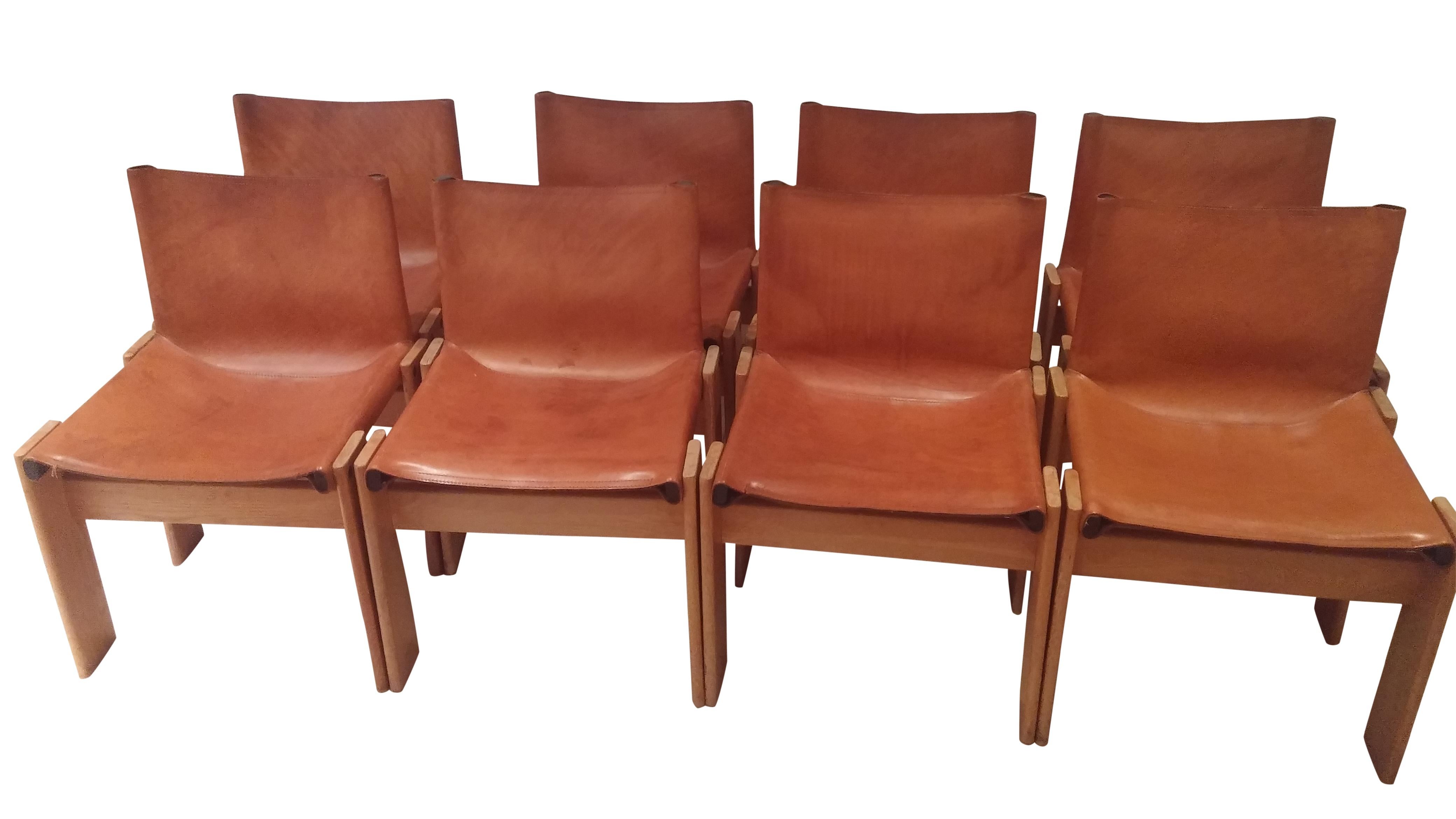 Set of 8 'Monk' chairs designed by Afra & Tobia Scarpa in 1974 & manufactured by Molteni.

These timeless and elegant chairs are made of a walnut wooden frame with fine cognac leather seat and backrests.

Good condition.

1974 - Italy

Some history