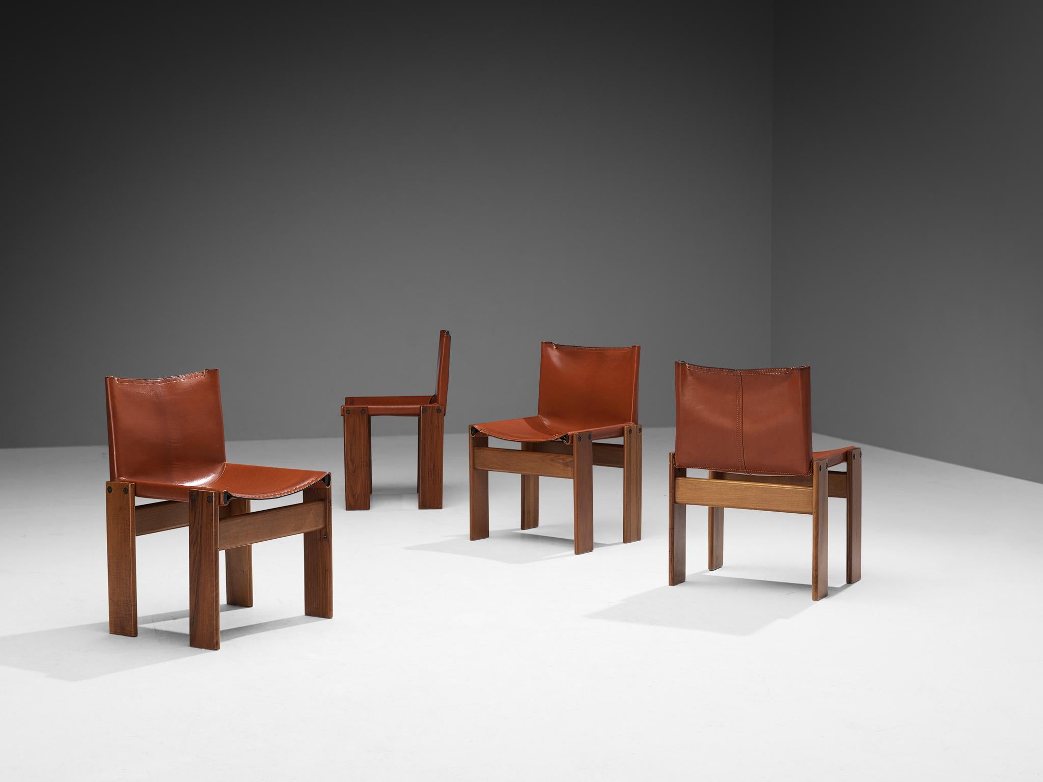 Afra & Tobia Scarpa for Molteni, set of four 'Monk' dining chairs, walnut, leather, Italy, 1974.

The deep red leather shows beautiful patina and forms a striking combination with the walnut wood. Interesting is the 'flat' shape of this chair