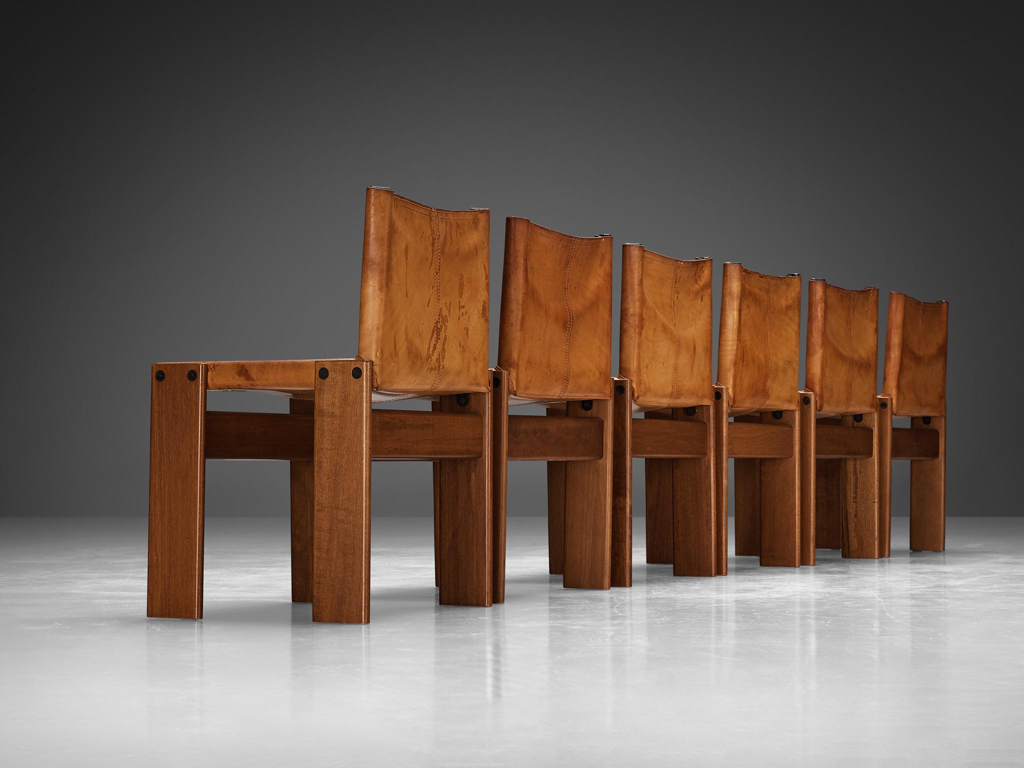 Afra & Tobia Scarpa for Molteni, set of six 'Monk' dining chairs, walnut, leather, Italy, 1974.

Set of six 'Monk' chairs by Italian designers Afra & Tobia Scarpa. The cognac leather forms a striking combination with the walnut wood. Interesting is
