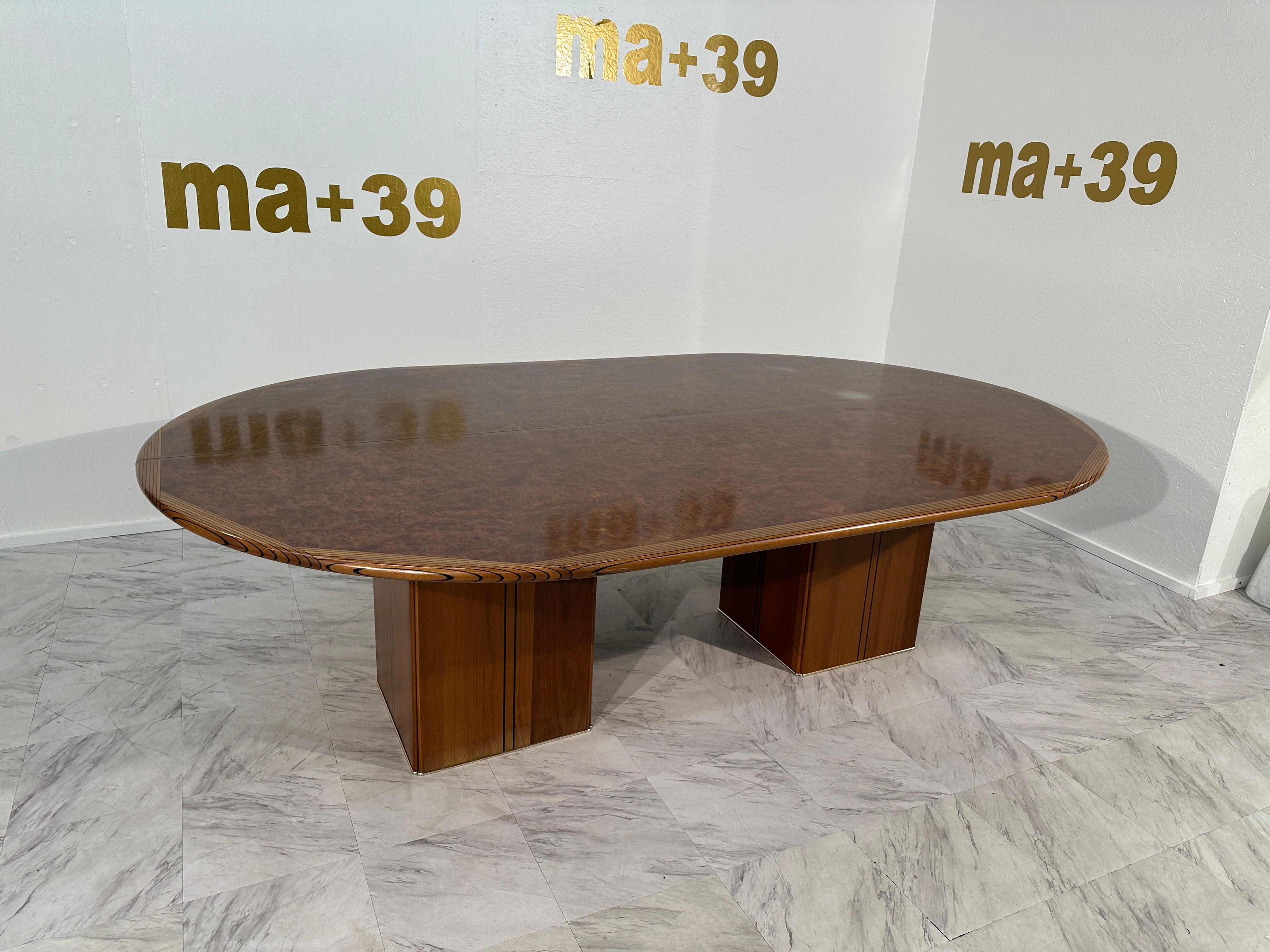 The Tobia & Afra Scarpa Large Africa Wooden Conference Table by Maxalto, hailing from 1970s Italy, epitomizes the sleek sophistication and craftsmanship characteristic of Italian design during that era. This conference table is a masterpiece of form