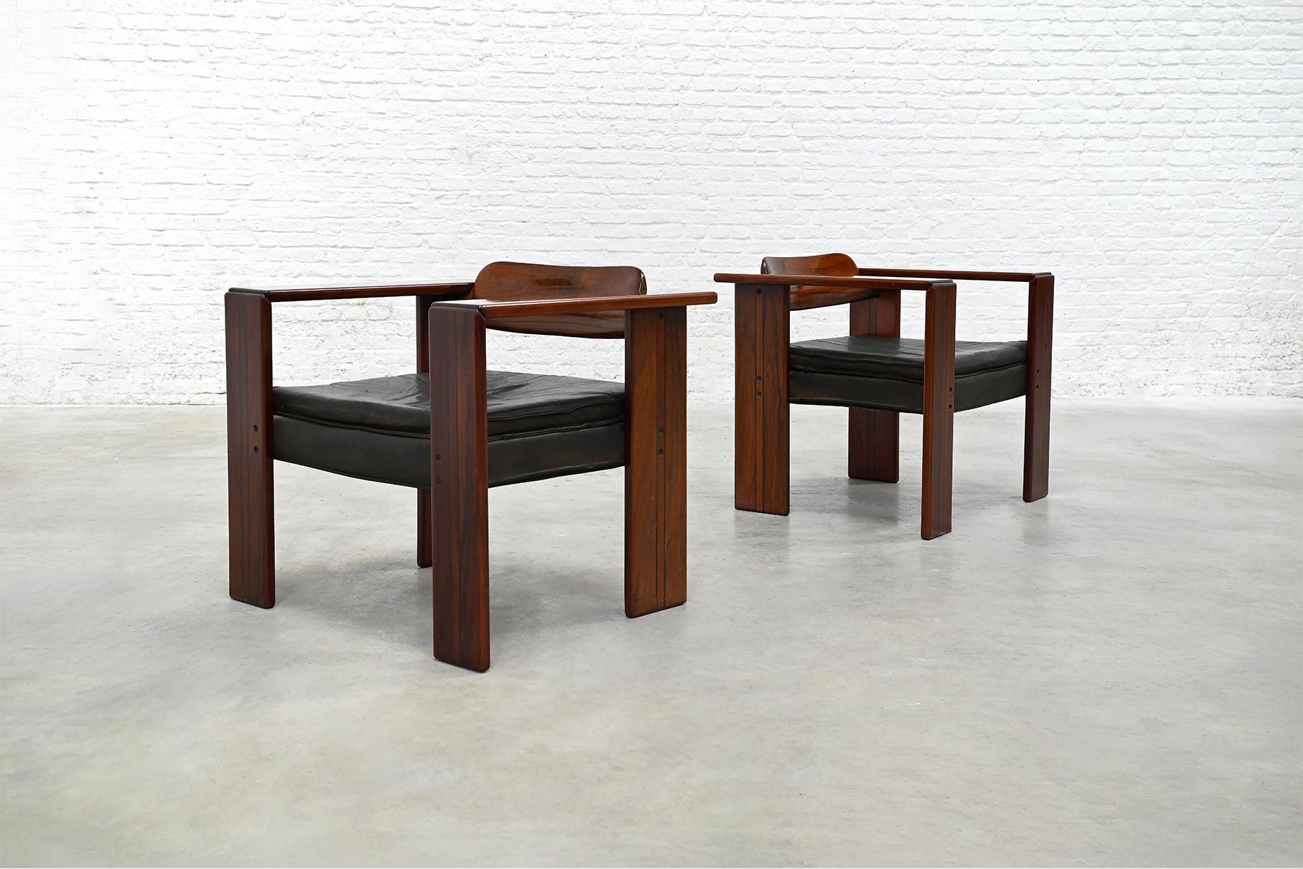 Designed by Afra & Tobia Scarpa for Maxalto in the 1970s, the Artona series represents a shift toward finely crafted, materially focused furniture within the broader B&B Italia group. These lounge chairs are constructed from solid walnut with
