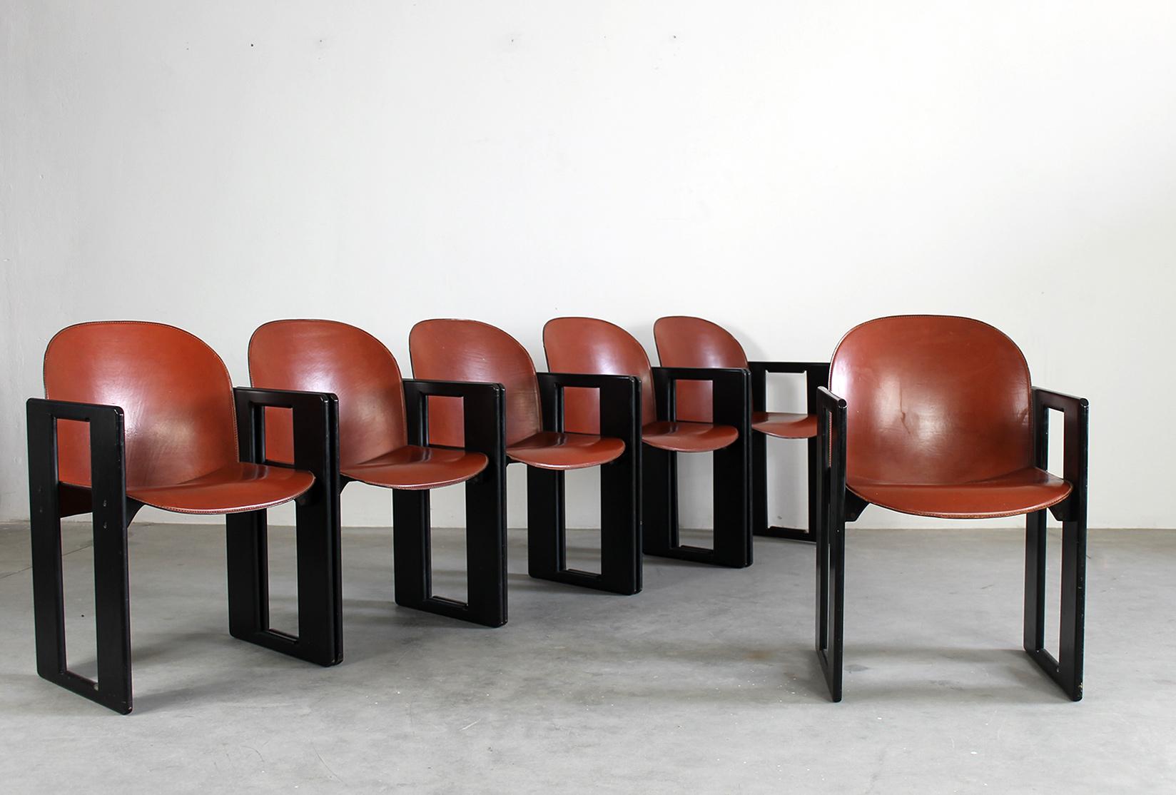 Set of six Dialogo chairs with structure in black lacquered wood, seat and back in leather and metal details. 
Designed by Tobia & Afra Scarpa and produced by B&B Italia in 1970s

The Dialogo chair present a peculiar geometric frame in wood to which