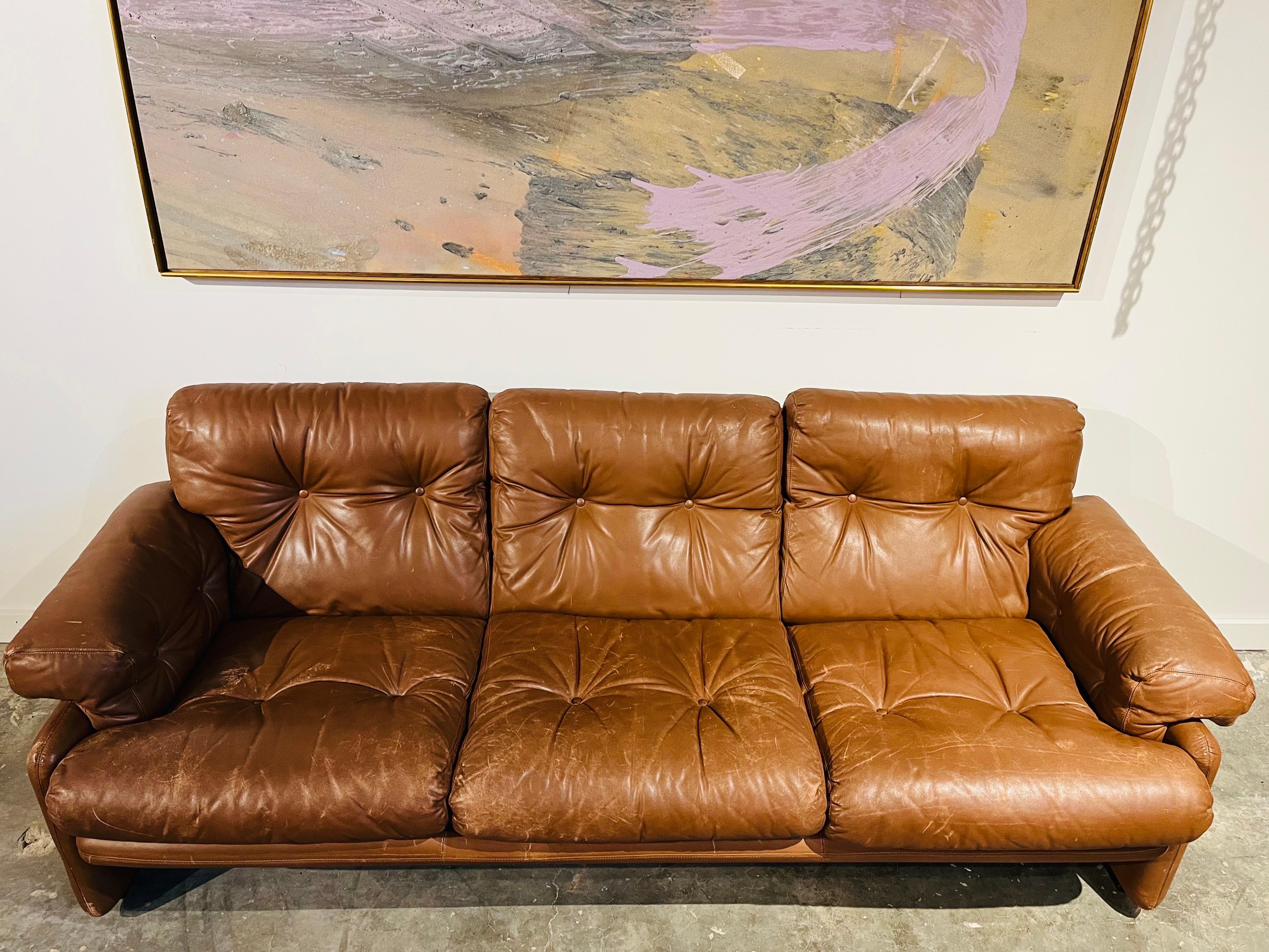 A vintage chocolate brown leather Coronado sofa by Afra and Tobia Scarpa for C and B Italia (C&B Italia) and retailed through Atelier International in New York City. This luxuriously comfortable, leather three seater sofa is a classic design first