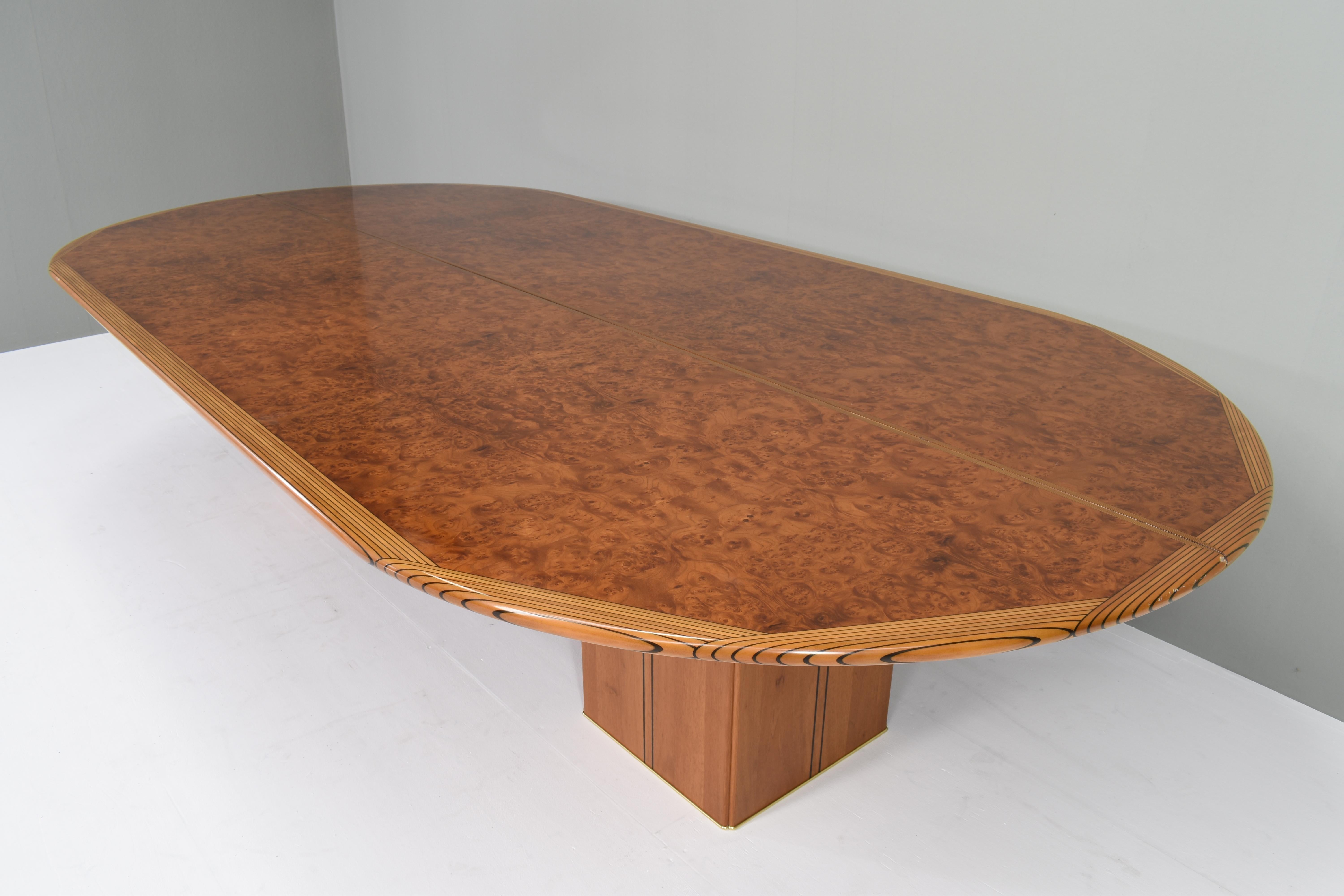 Large Africa series dining / conference table by Afra & Tobia Scarpa for Maxalto, Italy, circa 1970.
The tabletop is made in two pieces which are devided over the lenght. The top is supported by two square legs with brass details. In very good