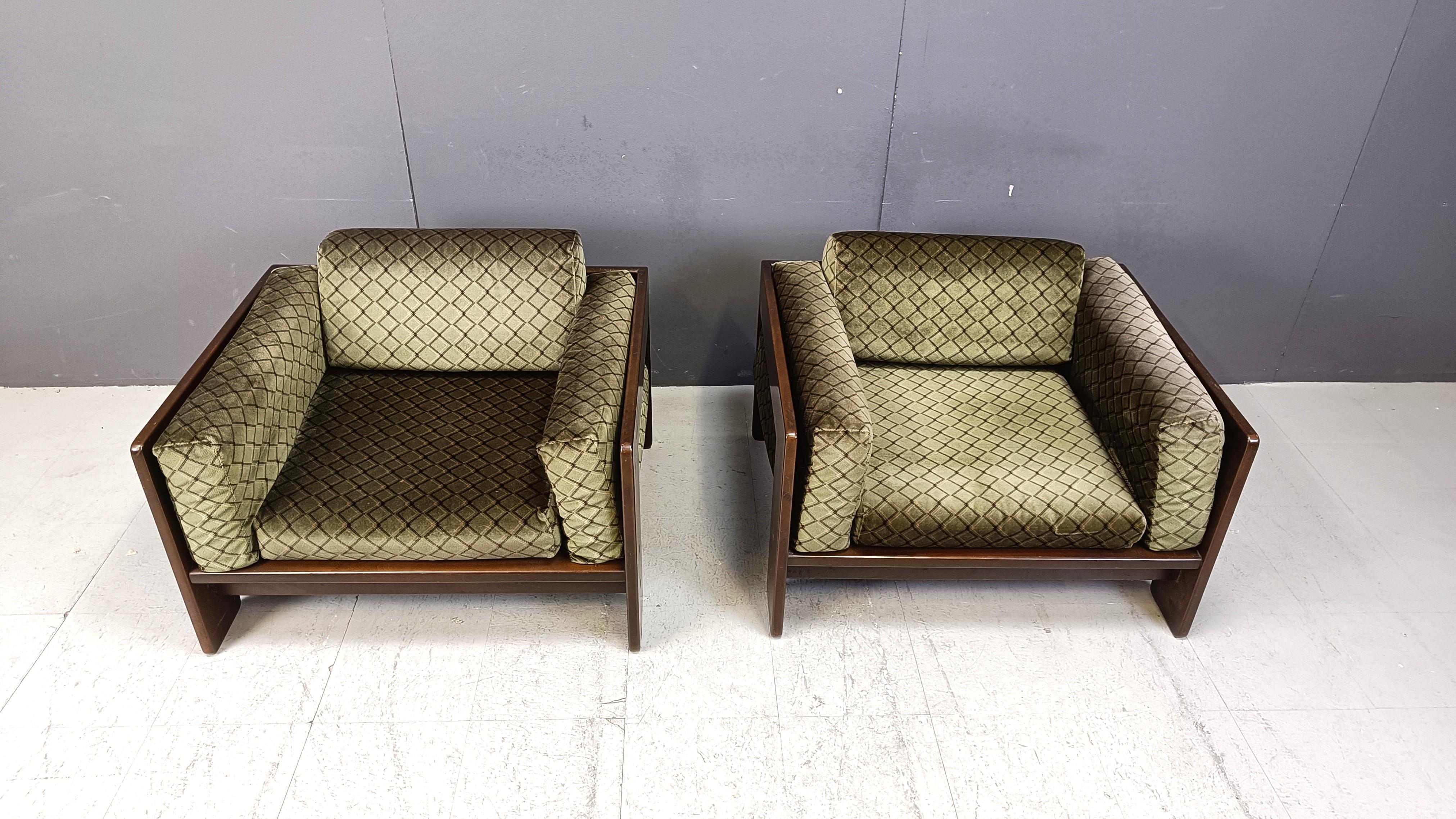 Mid century 'Bastiano' armchairs designed by Tobia Scarpa and designed for Knoll/Gavina.

These early editions date from the seventies and have their original green fabric with a cool seventies pattern.

Very comfortable armchairs.

Good overall