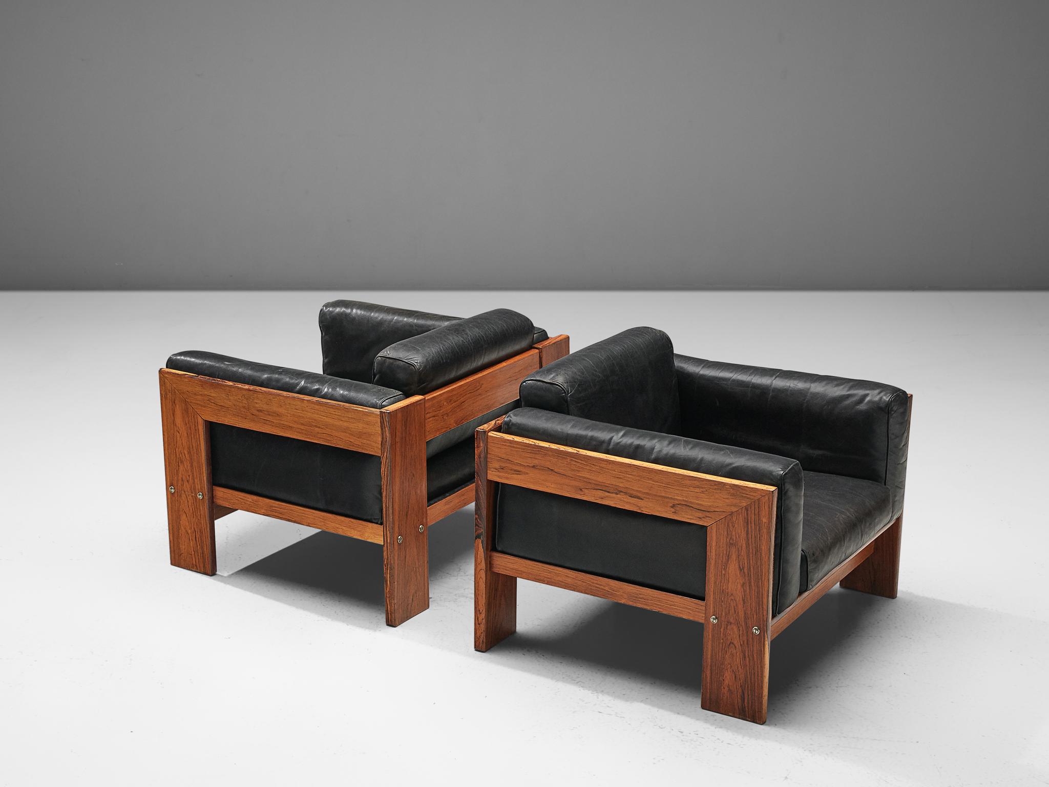 Tobia Scarpa for Knoll, pair of 'Bastiano' club chairs, leather and rosewood, Italy, design 1960, manufactured in 1970s.

Beautiful pair of Bastiano club chairs made with a rosewood frame and black leather cushions. Tobia Scarpa designed the