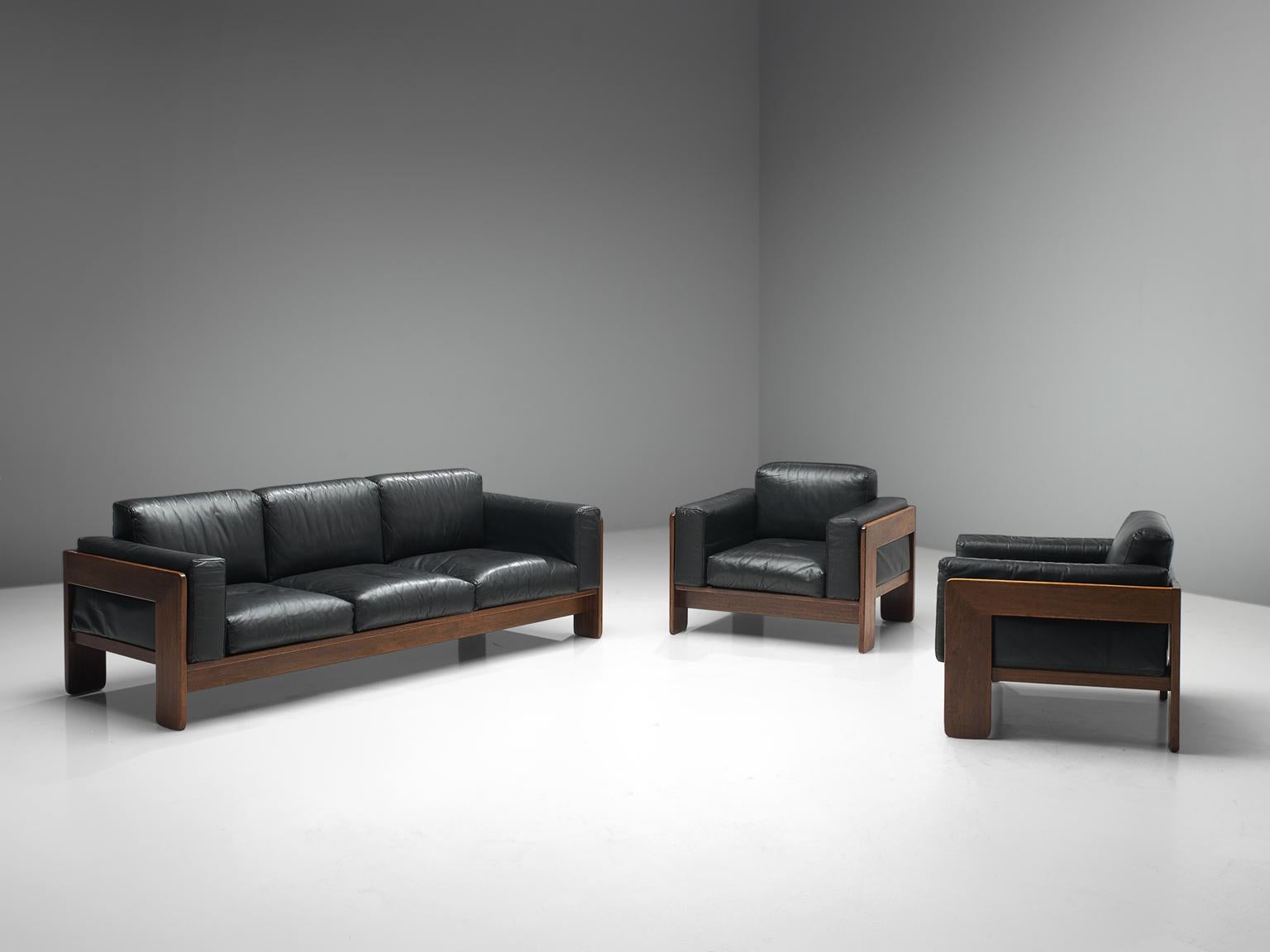 Tobia Scarpa for Knoll, 'Bastiano' living room set, leather and walnut, Italy, design 1960, manufactured in the 1970s.

Beautiful Bastiano lounge set, consisting of one sofa and two lounge chairs, made with a walnut frame and black leather