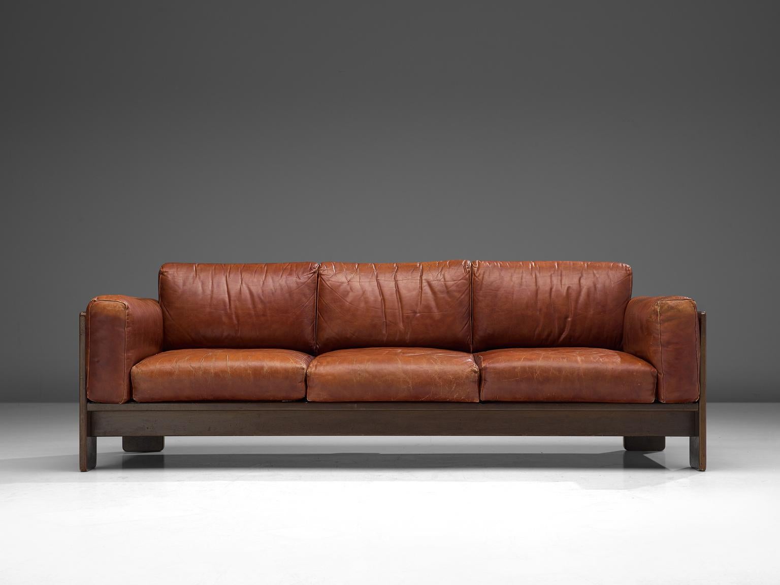 Tobia Scarpa for Knoll, 'Bastiano' sofa, leather and walnut, Italy, design 1960, manufactured between 1969-1970s.

Beautiful Bastiano sofa made with a walnut frame and dark cognac leather cushions. Tobia Scarpa designed the Bastiano series for the