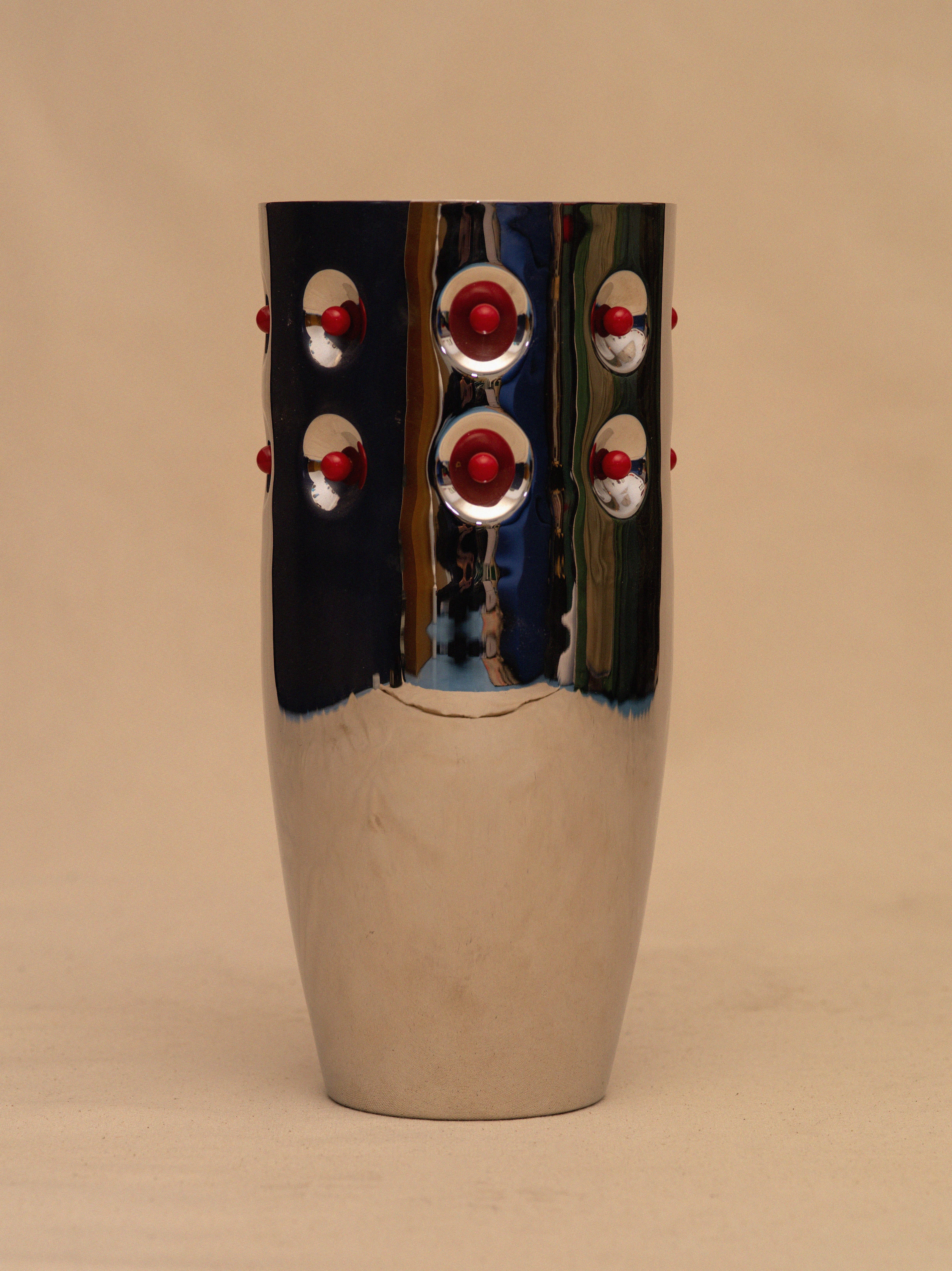 
Made in Italy, a large modern design steel vase with crimson balls. Marked on bottom. An extremely rare and hard to find vase. Unique as well as beautiful, powerful and elegant. Of course all objects I have are statements, but this Tobia Scarpa