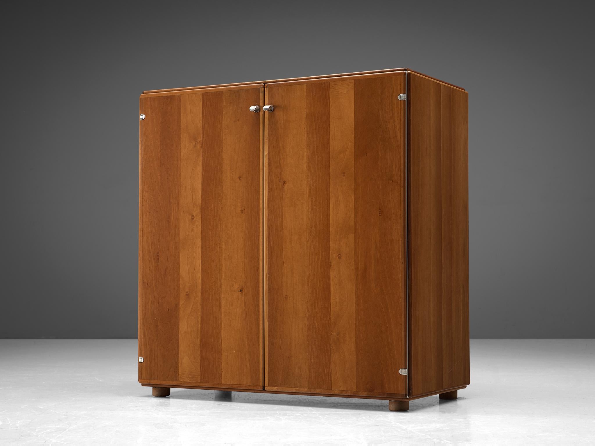 Tobia Scarpa, cabinet in walnut, Italy, 1960s

This cabinet was designed by Tobia Scarpa, and shows a clear design that characterizes the work of Scarpa. 
The piece shows wonderful subtle details, such as the rounded door edges and hinges that