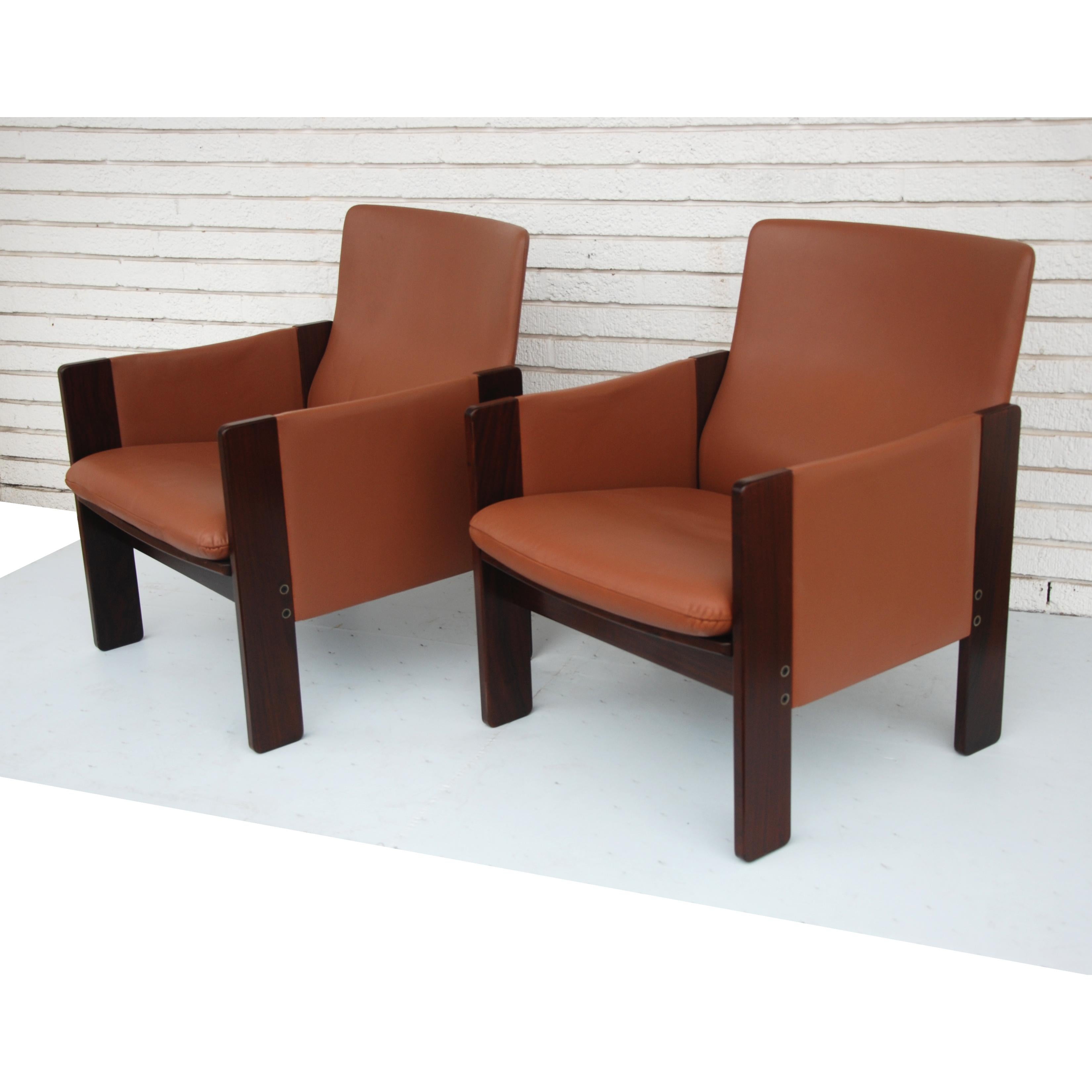 A pair of Mid-Century Modern lounge chairs designed by Tobia Scarpa and made by Cassina. Rosewood frames with leather upholstery.
