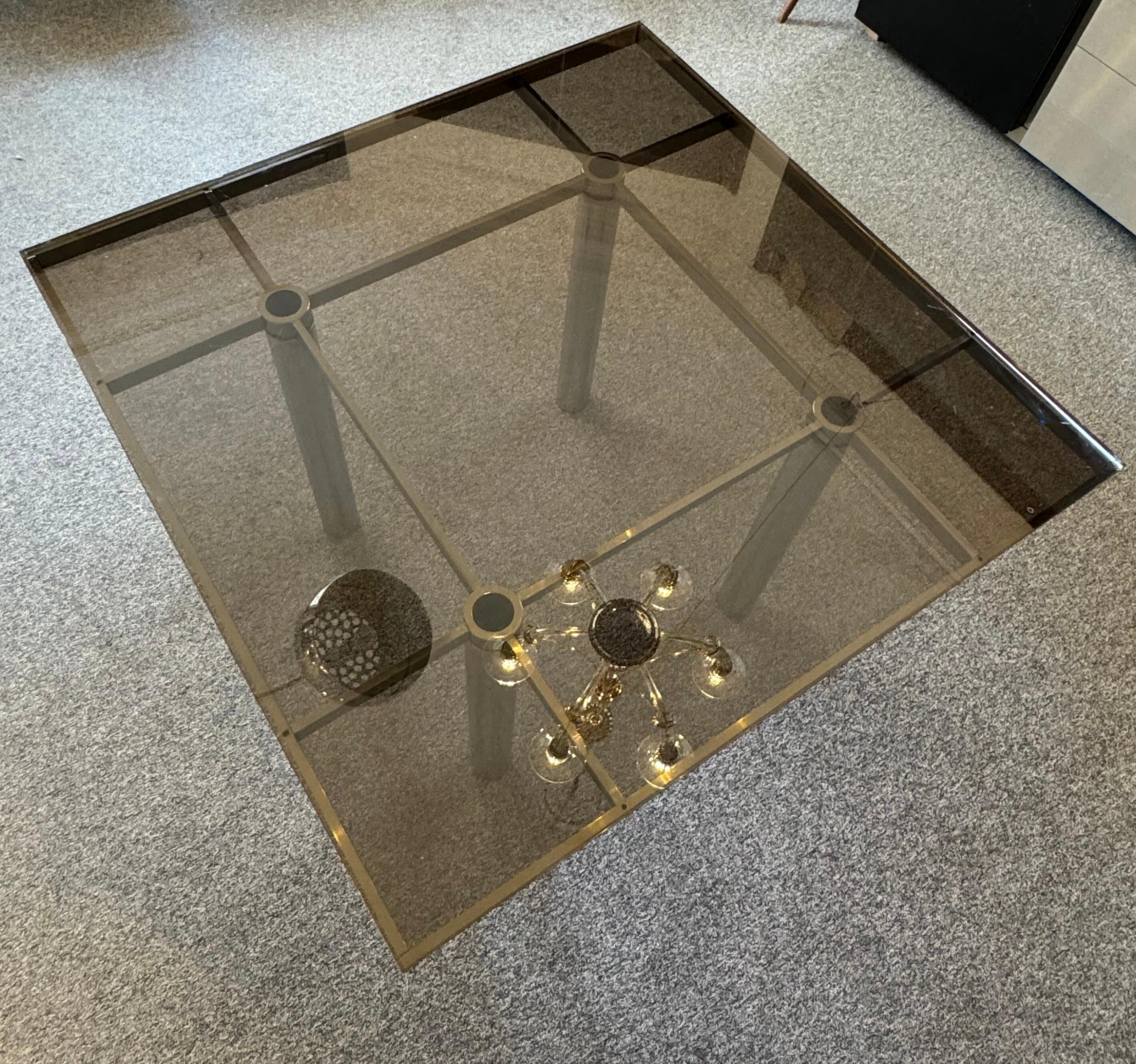 Mid-Century steel and smoked glass dining table by Tobia Scarpa for Gavina.
Part of the 'Andre' range, circa 1970s.
Large sized dining table made of tubular polished steel legs, with a geometrical steel platform supporting thick heavy smoked glass