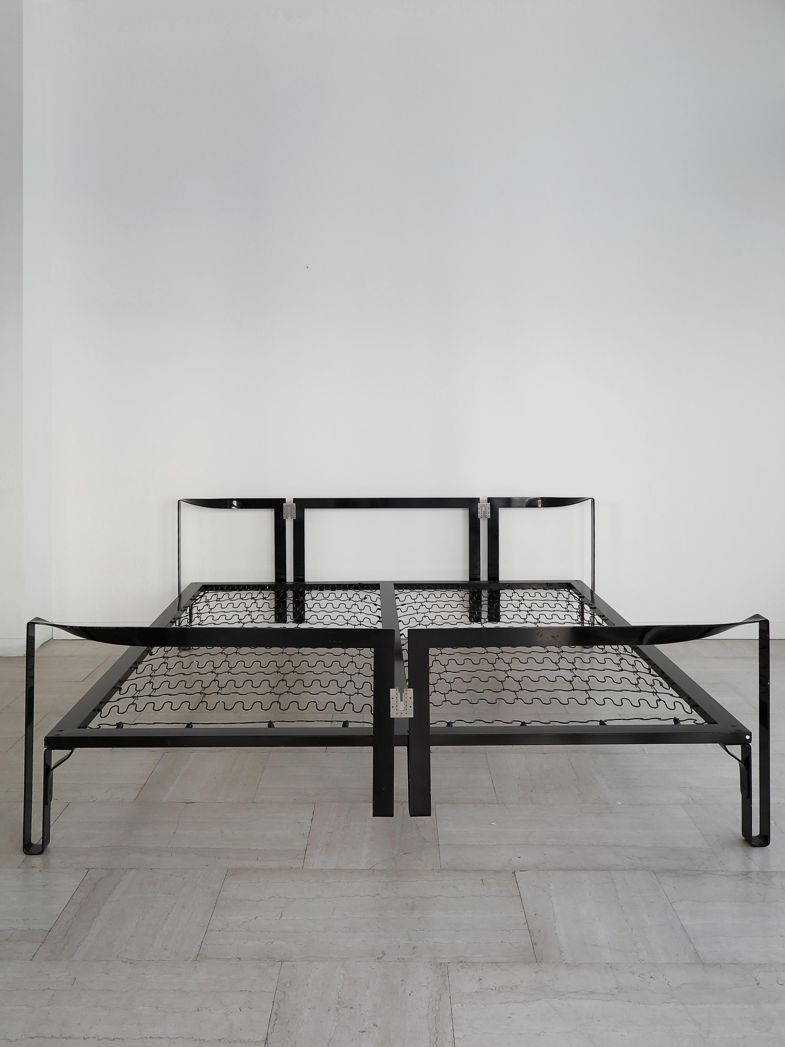 Italian Mid-Century Modern design double bed model Vanessa, designed by Tobia Scarpa and produced by Gavina since 1962 composed of a curved black painted metal band completely disassembled, Gavina spa Made in Italy adhesive label, 1960s.

Please