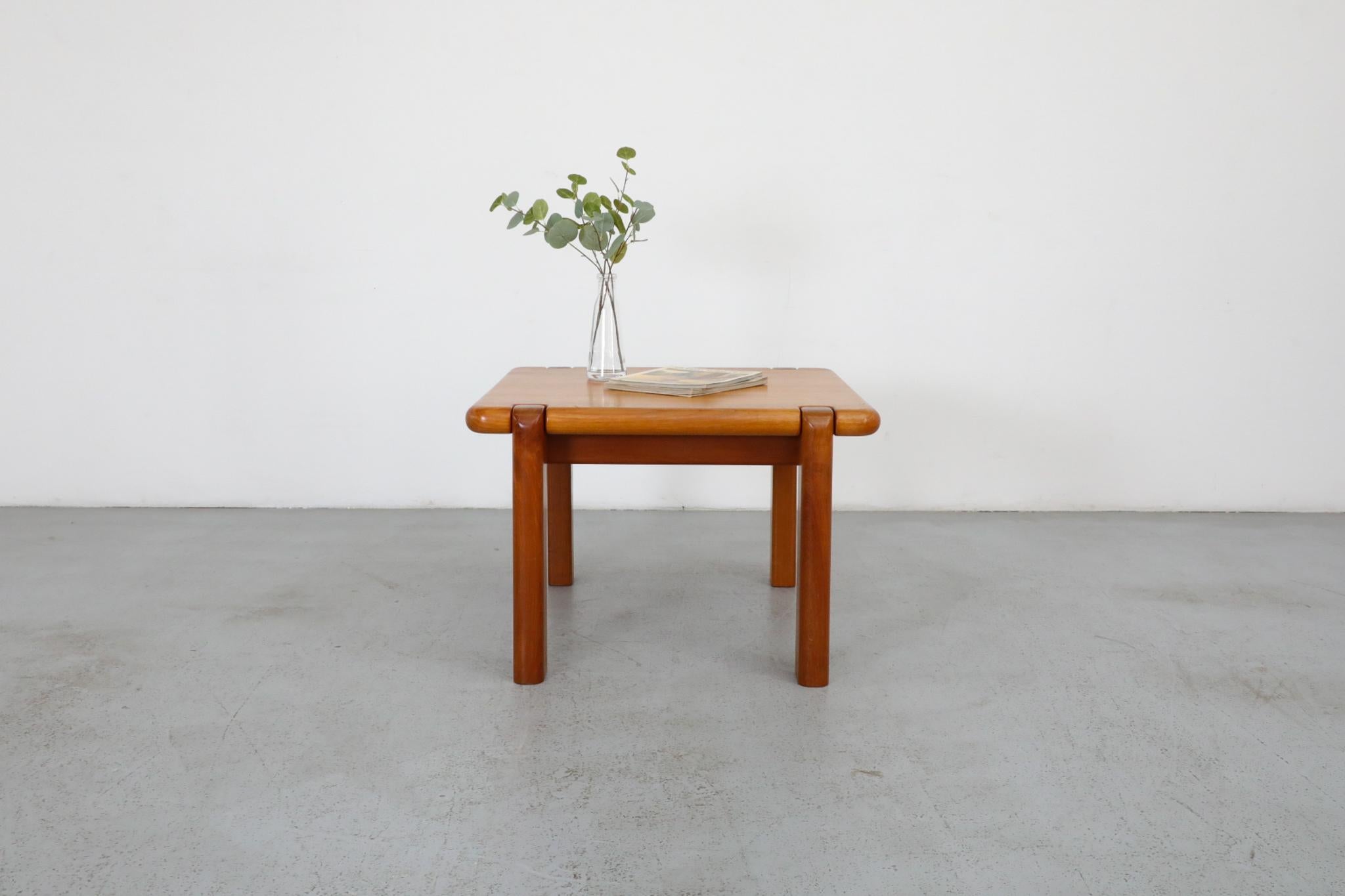 Handsome Tobia Scarpa inspired heavy teak coffee or side table by Drylund. Attractive curves and soft lines highlight its craftsmanship and style. Lightly refinished, this table is in original condition with wear consistent with age and use.