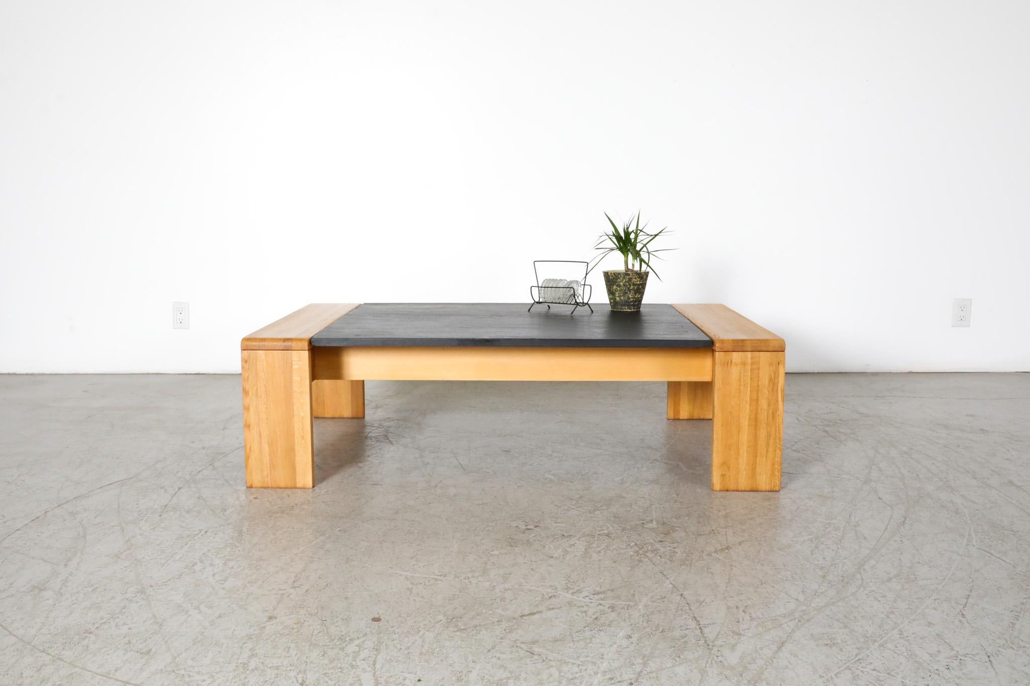 Mid-Century, Leolux made, stone top coffee table. Similar in appeal to the work of Tobia Scarpa. Beautiful carved oak wood frame with inset slate stone make this a gorgeous pairing of organic materials with clean, austere esthetics. Perfect for an