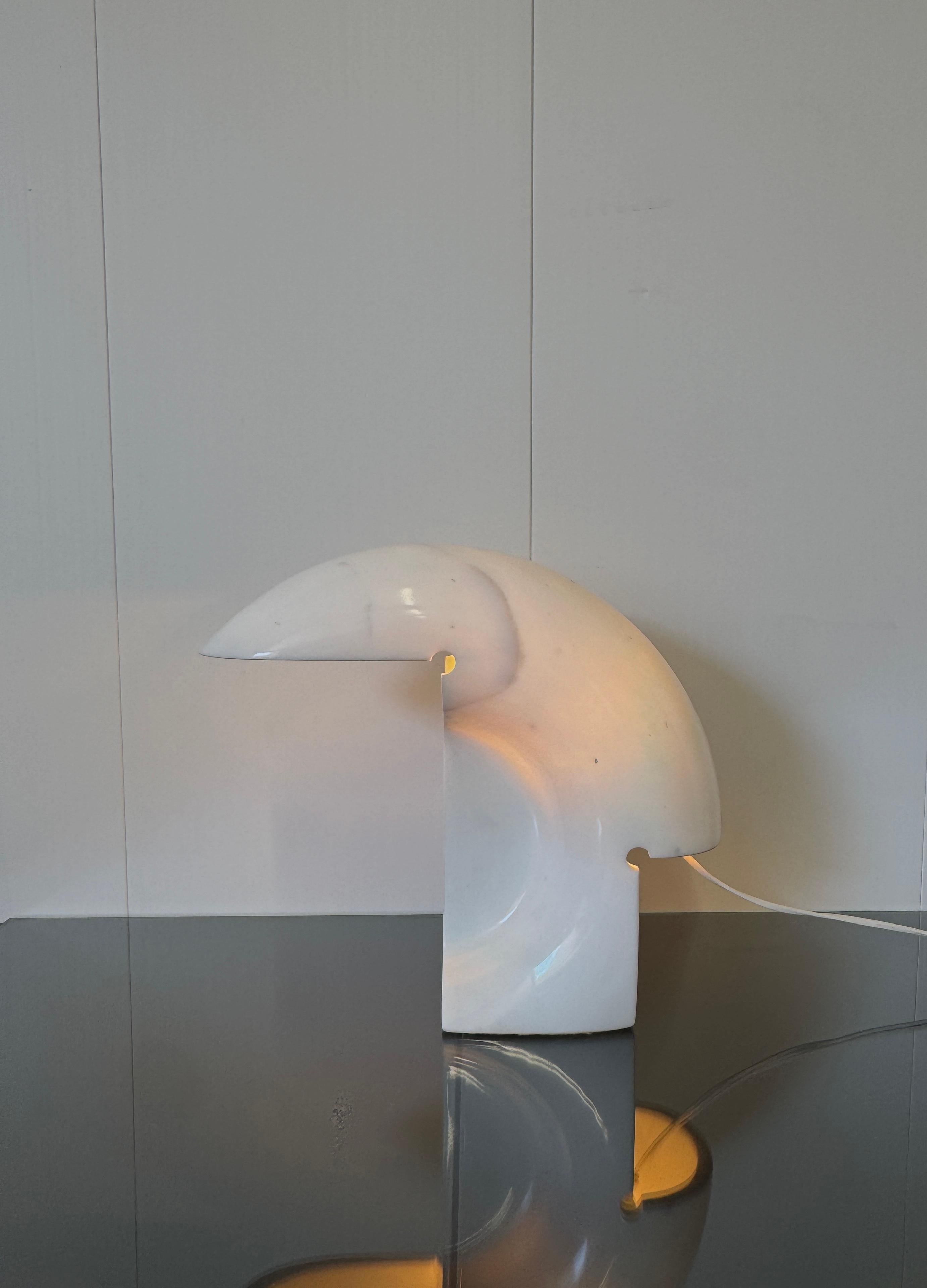 Designed in 1968 by Tobia Scarpa and produced by Flos, the Biagio table lamp consists of a body carved from a single hollowed block of white Carrara marble.

The Biagio table lamp is a luxury item capable of discreetly embellishing any room.
Icon of