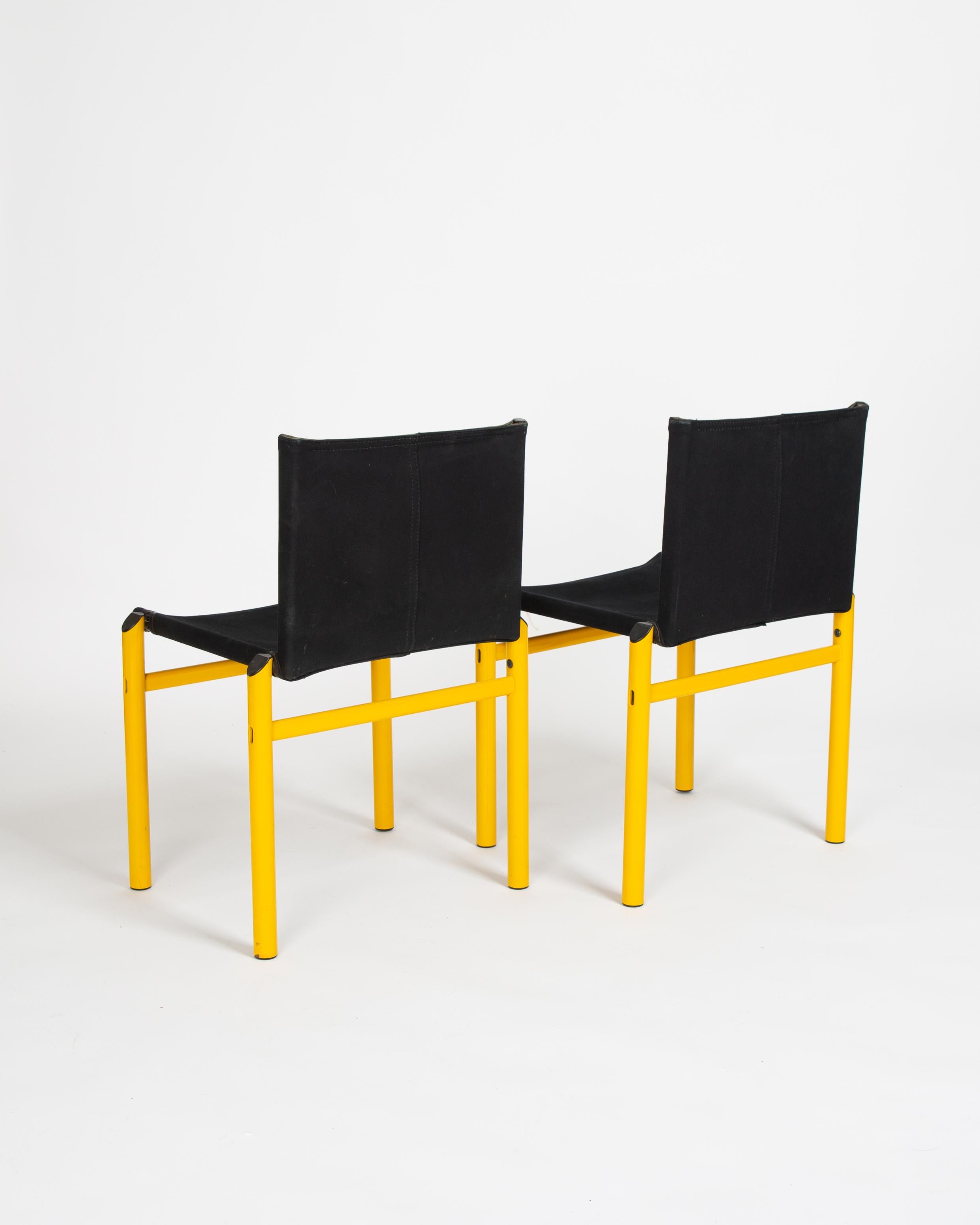 A pair of extremely uncommon Afra & Tobia Scarpa Mastro Chairs. 

The Mastro design was created on the same structural principle as the Monk chair, but in a new dialect, shape and feel that only the 1980’s could help articulate. 

Powder coated