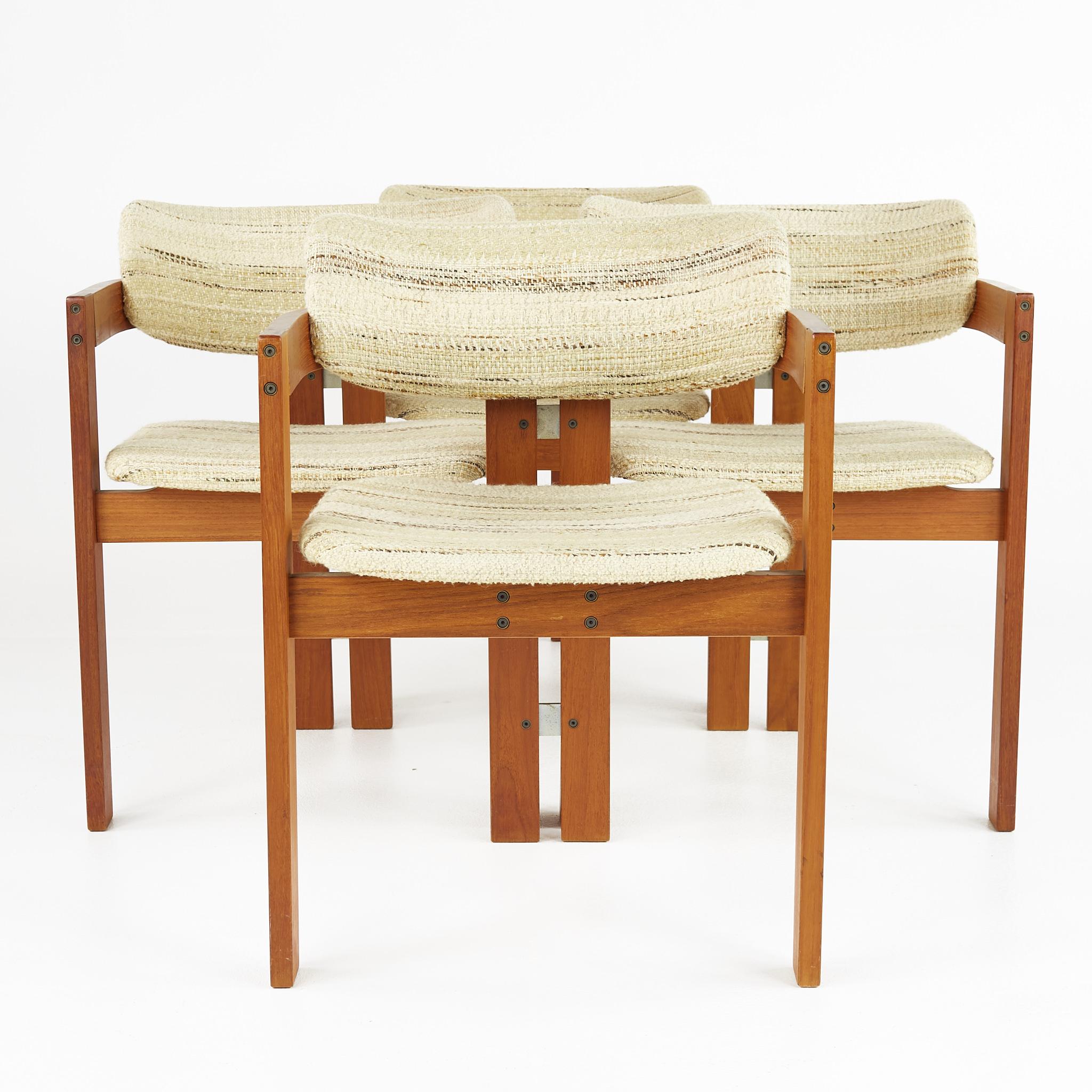 Afra and Tobia Scarpa style mid century teak dining chairs - set of 4

Each chair measures: 21.5 wide x 19.5 deep x 28.5 inches high, with a seat height of 18 and arm height of 25 inches

All pieces of furniture can be had in what we call