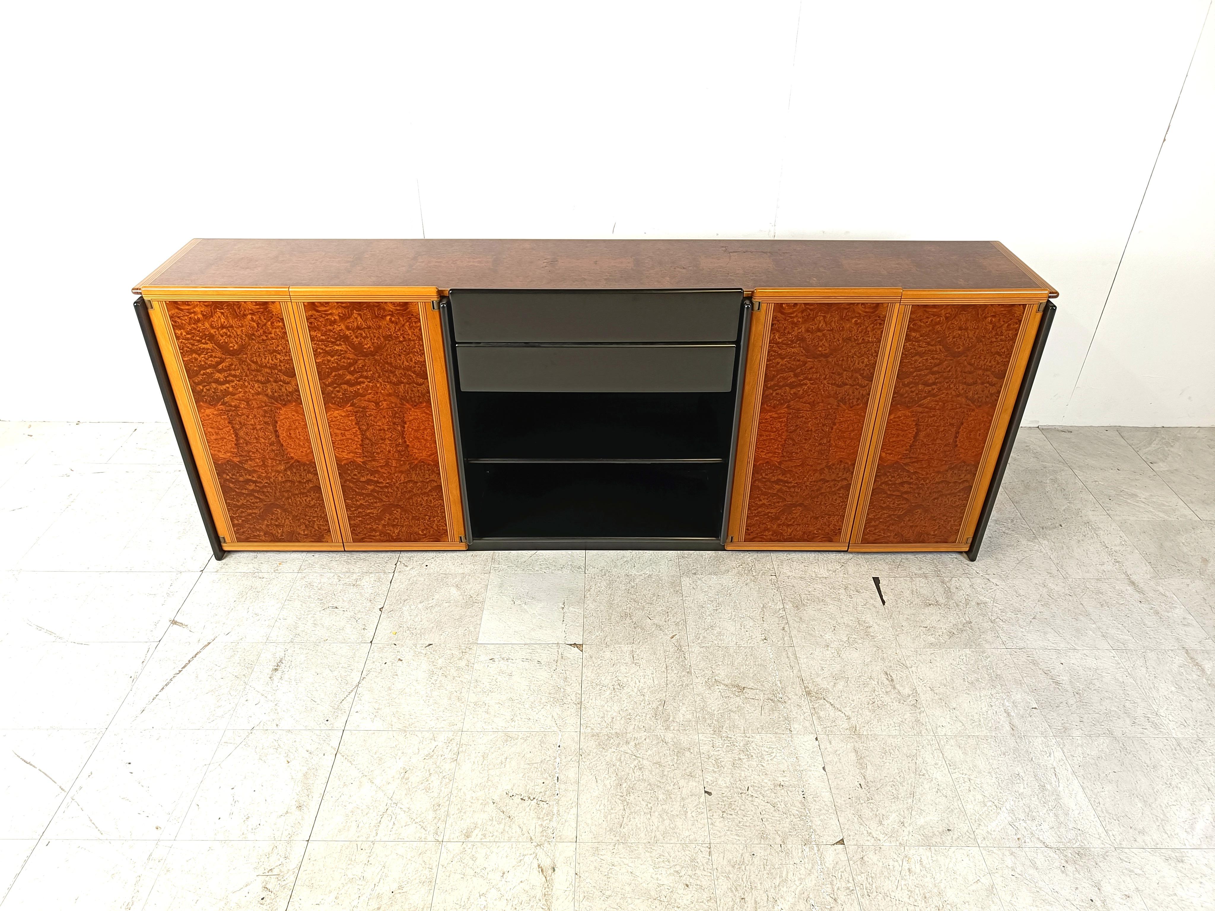 Striking sideboard by Tobia Scarpa

The use of the finest woods and craftmenship resulsts in this mind blowing sideboard.

Notice the fine black lines running troughout and the incredible finish of the wooden panels.

This sideboard is ideal  to