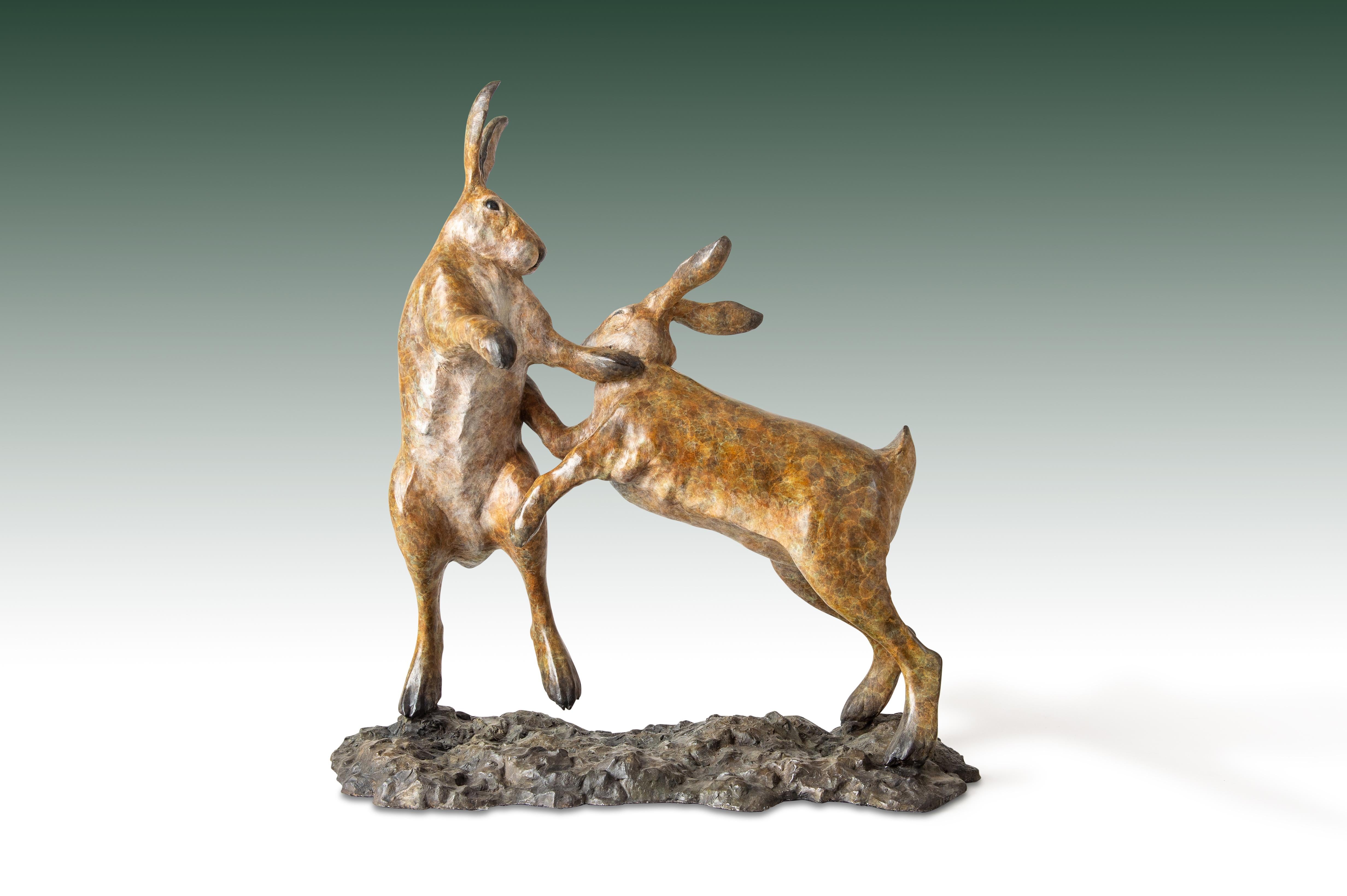 'Boxing Hares' by Tobias Martin is a Solid Bronze Animal Sculpture. 

Tobias Martin was born in 1972 in Wiltshire, 12 miles from Stonehenge. Influenced by his idyllic rural upbringing, and the forces of nature and magic that permeated his childhood