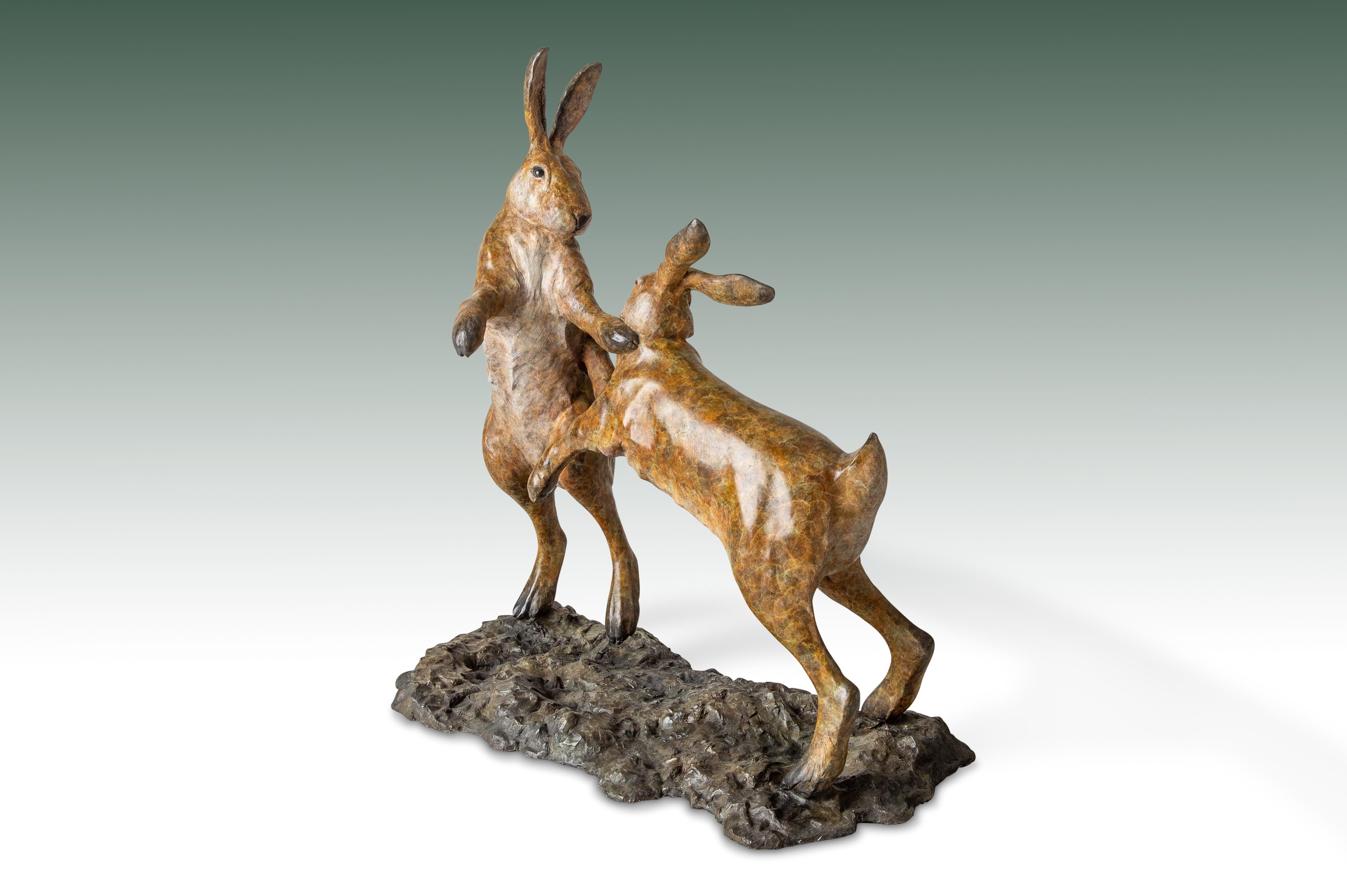 'Boxing Hares' Bronze Sculpture of two fighting hares, patinated brown, wildlife