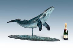Bronze Sculpture Majestic Humpback Whale swimming in the sea, Blue & White