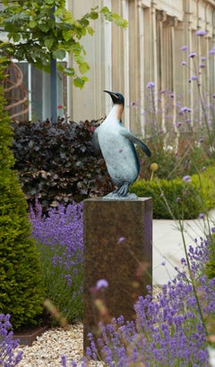 Contemporary Bronze Sculpture of a King Penguin, vivid blue, sea bird, rocks
