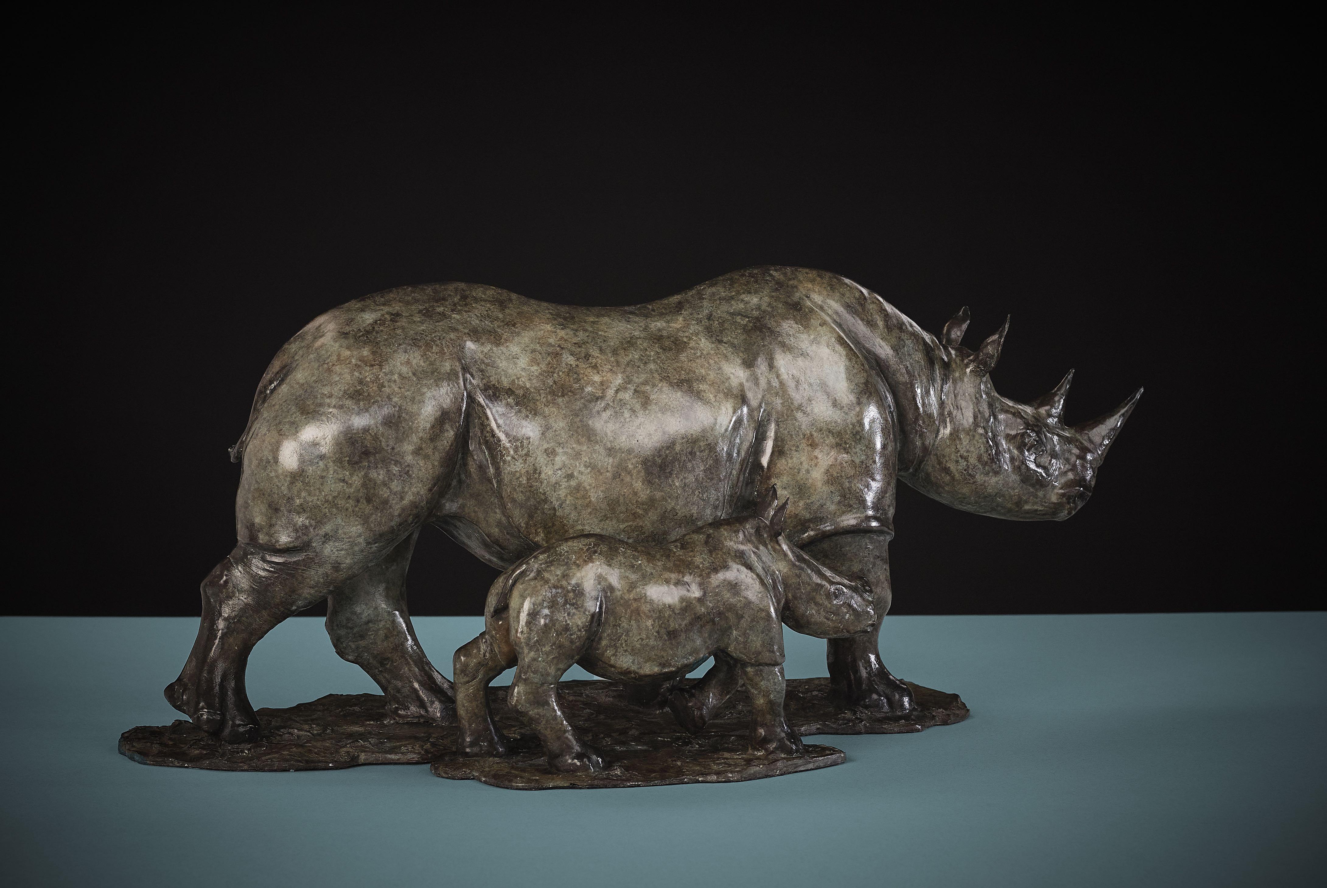 'Rhino and Baby Rhino' by Tobias Martin is a Solid Bronze Animal Sculpture. 

Tobias Martin was born in 1972 in Wiltshire, 12 miles from Stonehenge. Influenced by his idyllic rural upbringing, and the forces of nature and magic that permeated his