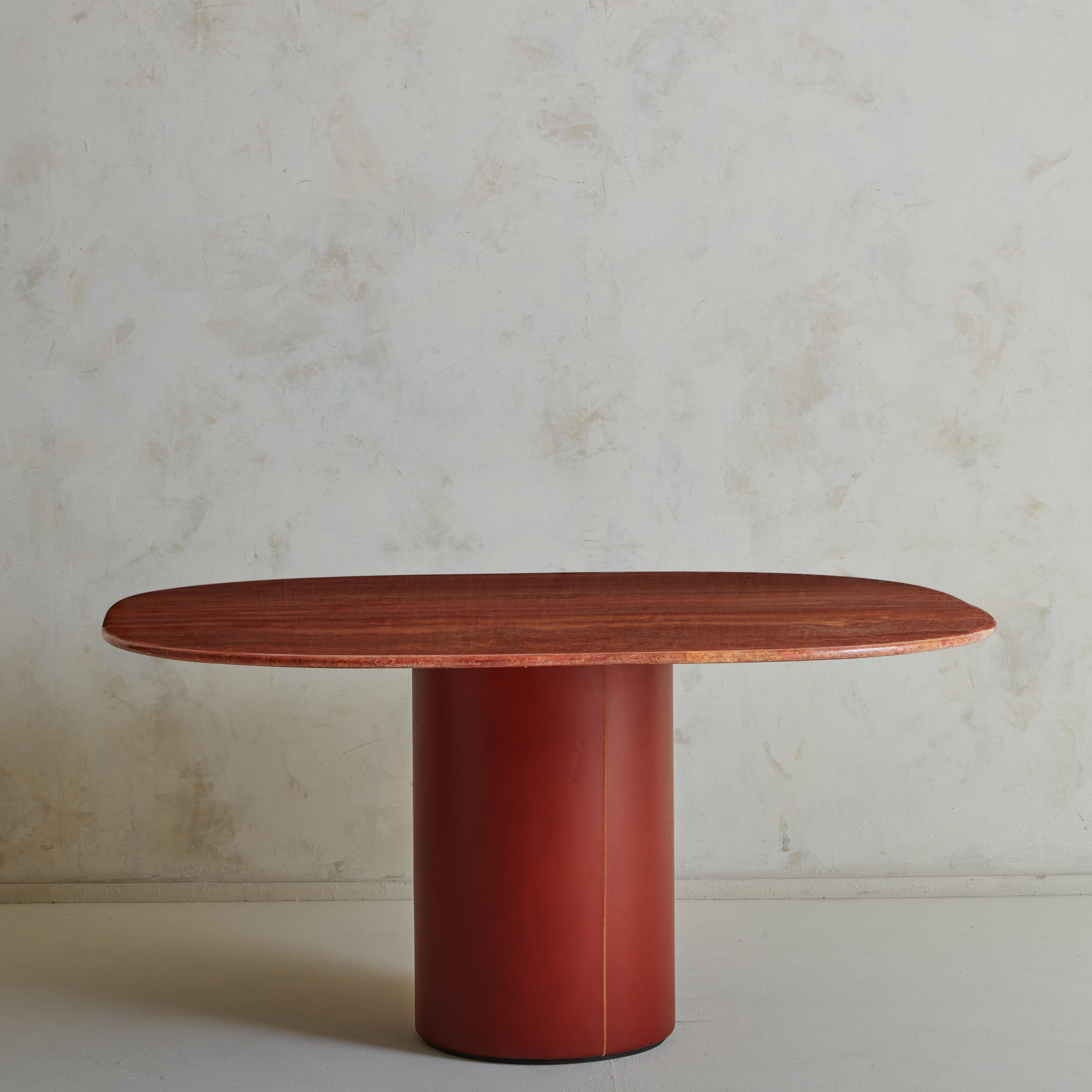 A highly elegant ‘Tobio’ dining table by designers Afra e Tobia Scarpa and produced by B&B Italia, 1974. Featuring a leather clad base with a red Persian travertine top - a wonderful combination of timeless materials and a true heritage piece.