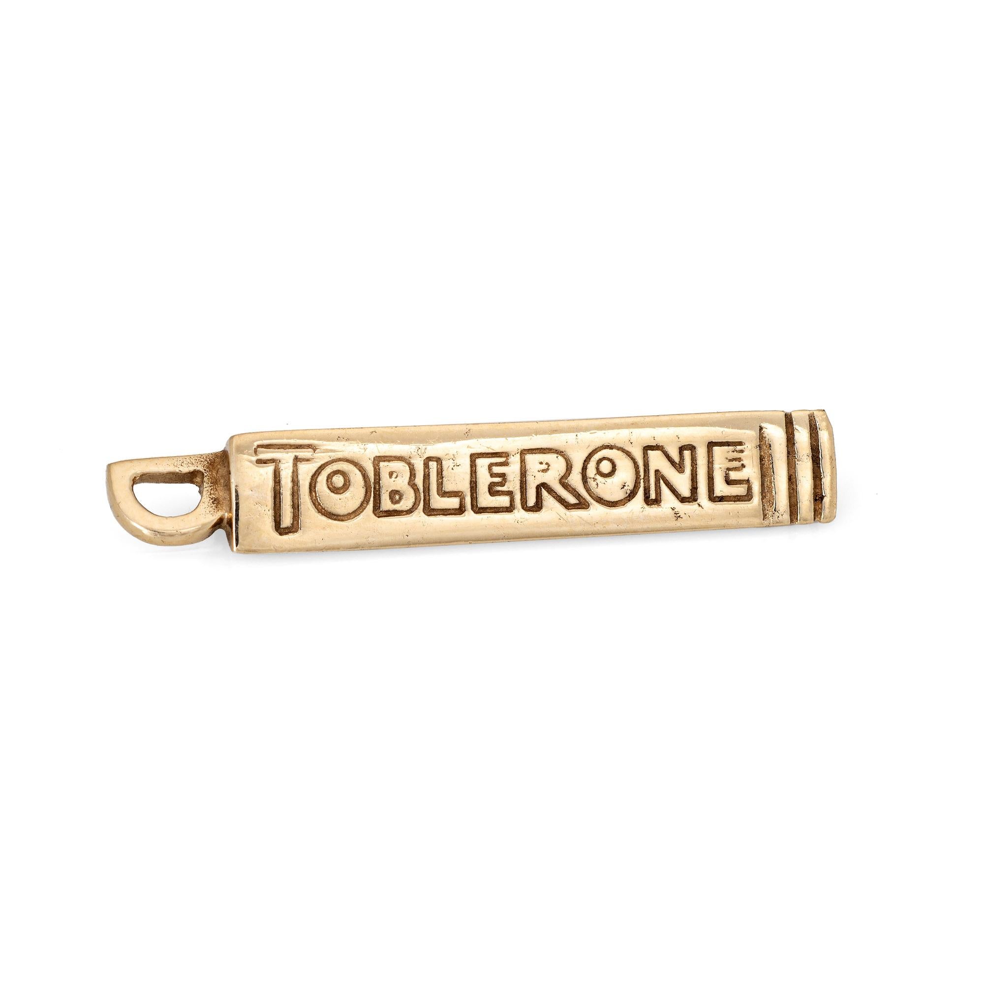 Finely detailed vintage Toblerone chocolate candy bar charm crafted in 9k yellow gold.  

The charming Toblerone charm features the logo on two sides (the charm is three dimensional). Made in 1982 in the UK (with English hallmarks) the fun piece is