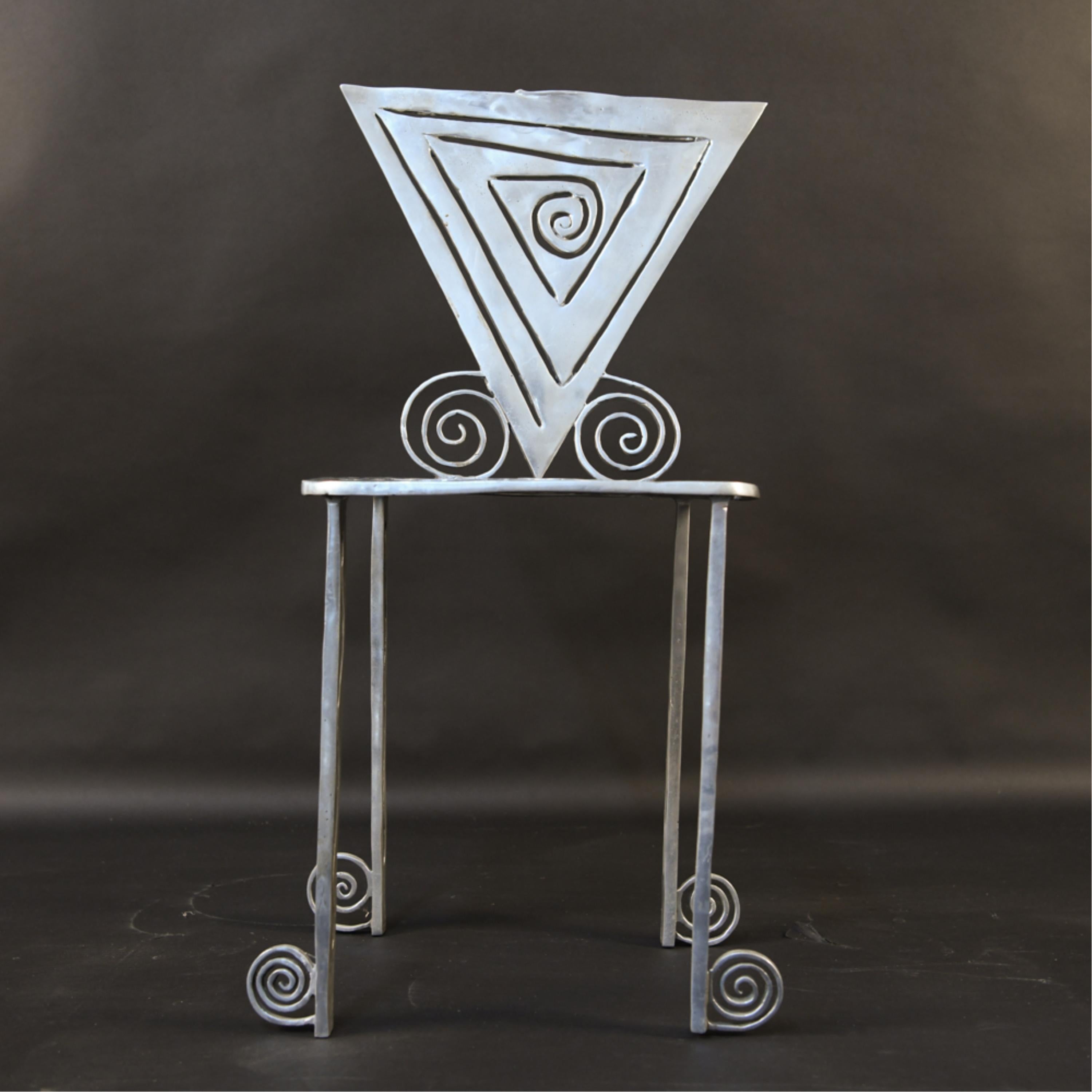 Toby Heller, American (1927-2017).
Spiral design side chair. Cut, welded and polished aluminum, c. 1980's. Apparently unsigned.
Provenance: from the artist's estate.
A woman of seemingly endless artistic talent and inspiration, Toby Heller was a