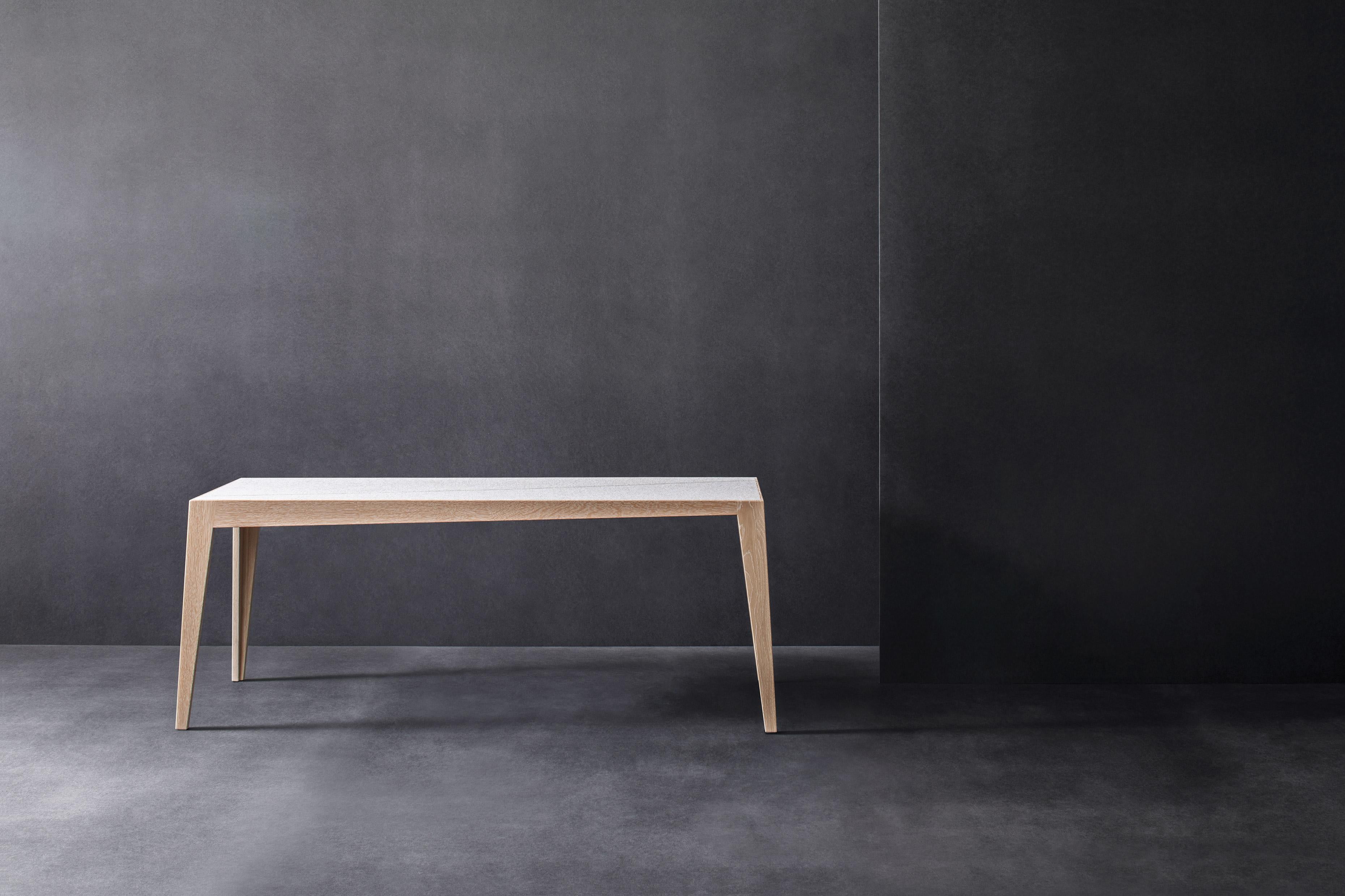 Tocker bench by Matthias Scherzinger
Dimensions: H 48 x W 40 x L 120 cm
Materials: oak white lyed, oil
 seat: needled felt light-grey

Also available in black oak.
Other sizes and types of wood.

The Tocker is a lightweight solid wood table