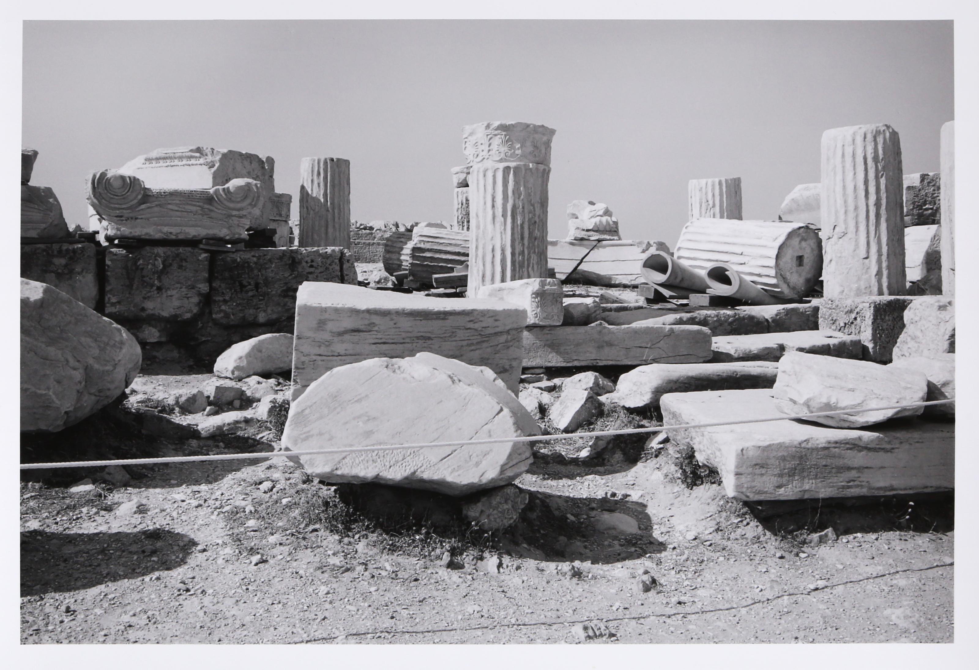 Field of Marble is a gelatin silver print from On the Acropolis, a portfolio of 25 photographs by Tod Papageorge made on the Athenian Acropolis in the summers of 1983 and 1984. The image depicts a close view of scattered marble architectural