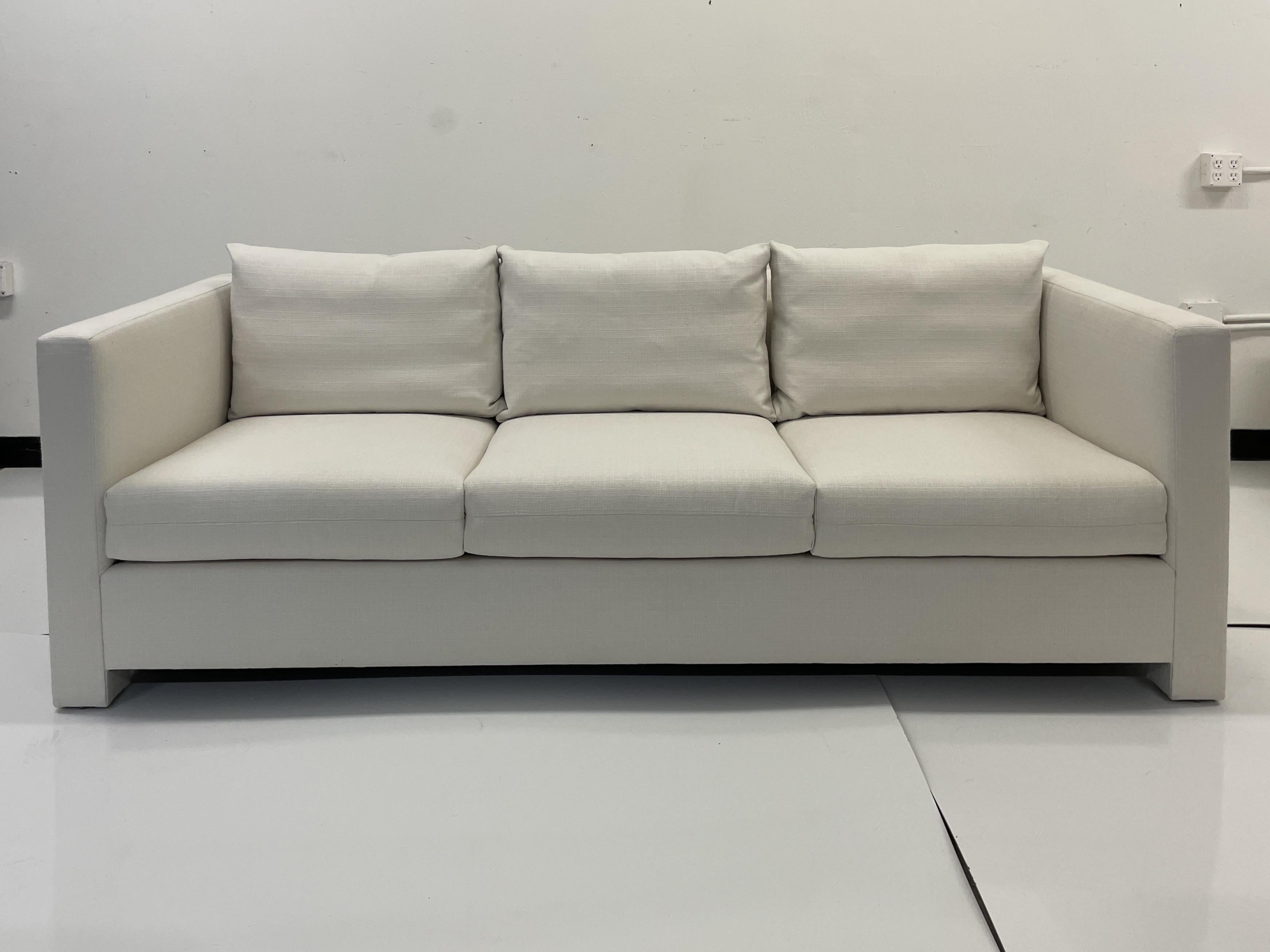 Classic Modern Details with fabulous tailoring designed by Todd Hase. Add some Modern Elements to your Living Space. This Classic Sofa will work well with many styles of interiors and is upholstered in Todd Hase Textiles High Performance Off White .