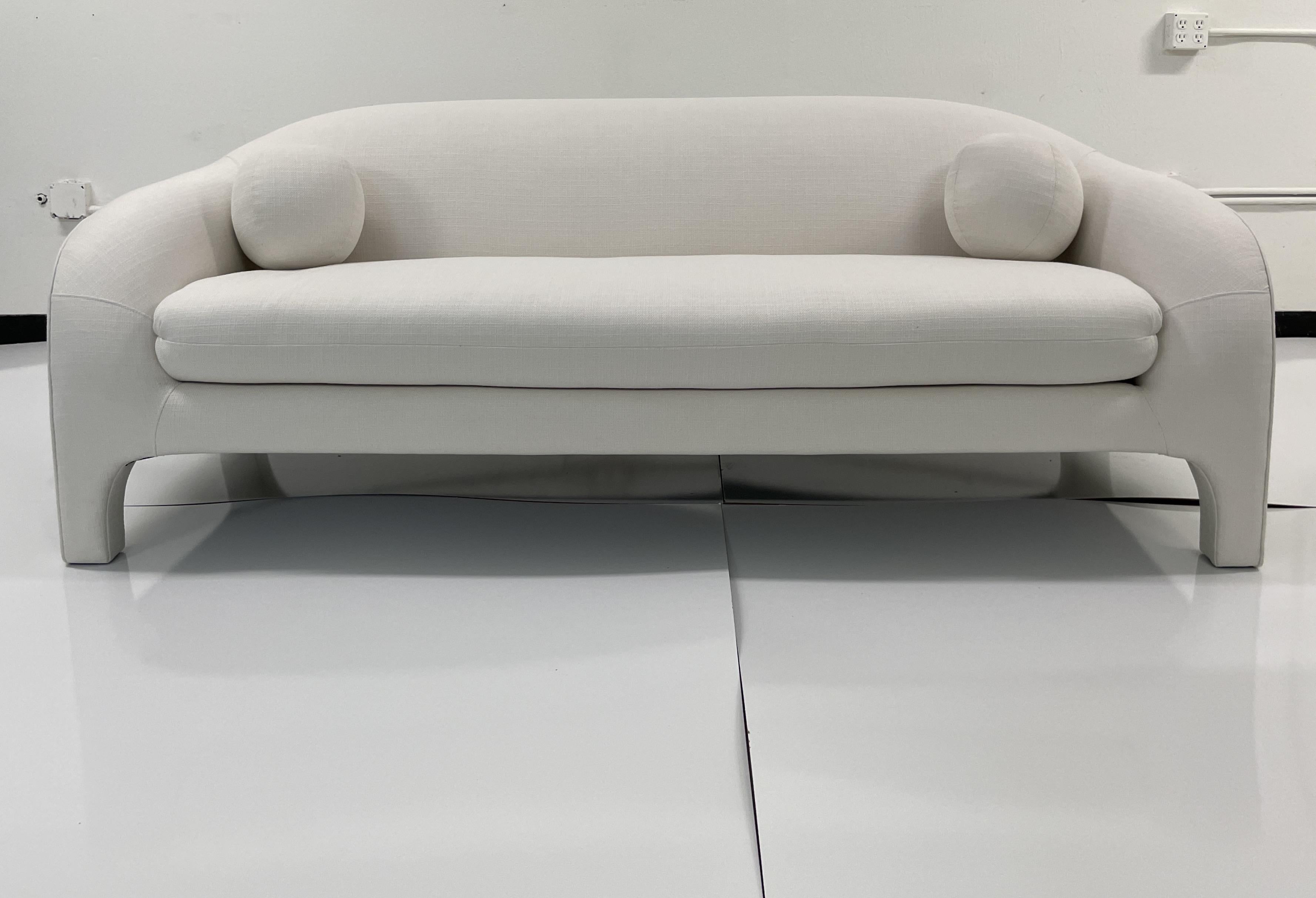 Classic Modern details with fabulous curved shapes designed by Todd Hase. Add some modern elements to your living space. This classic sofa will work well with many styles of interiors and is upholstered in Todd hase Textiles high performance off