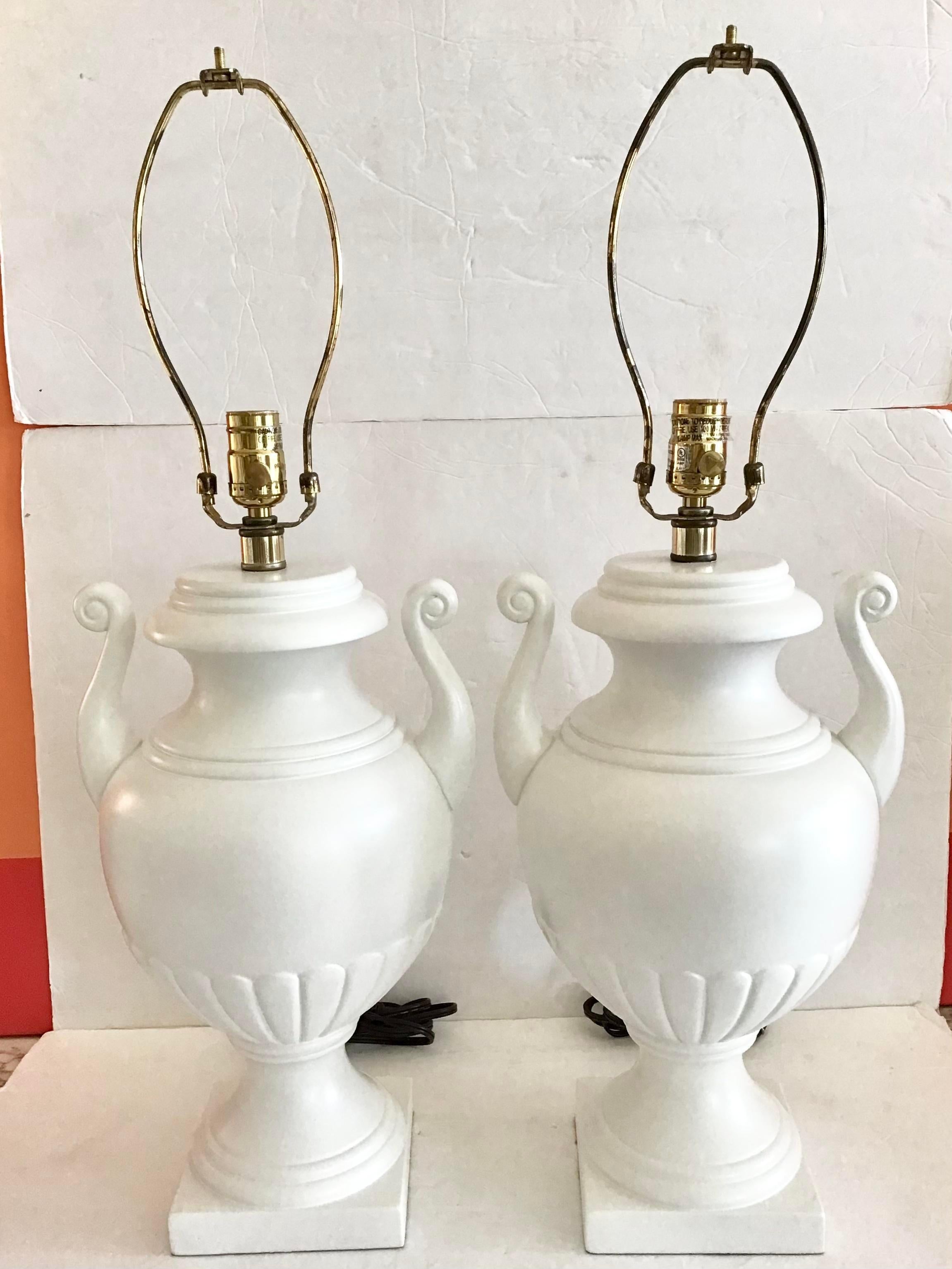 Pair of discontinued Todd Hase white urn ceramic table lamps lacquered in white. Nice neoclassical design. A classic. Just add finials and shades of your choice.