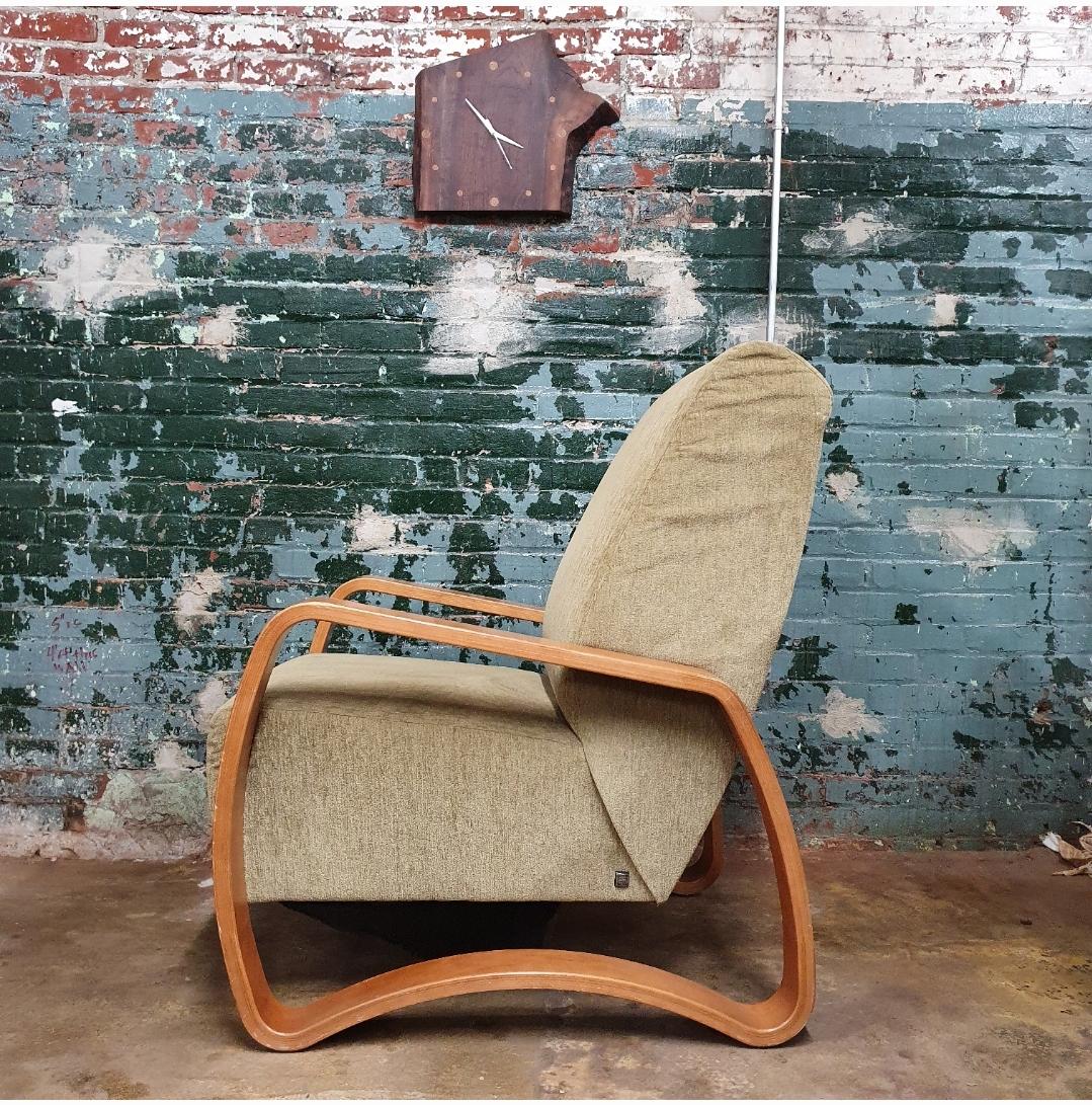 Stylish post modern lounge chair by Todd Oldham. Beautiful bentwood cherry frame with original green fabric. this chairs design is reminiscent of the famed architect Alvar Aalto lounge designs for artec in the 1930s and 1940s.