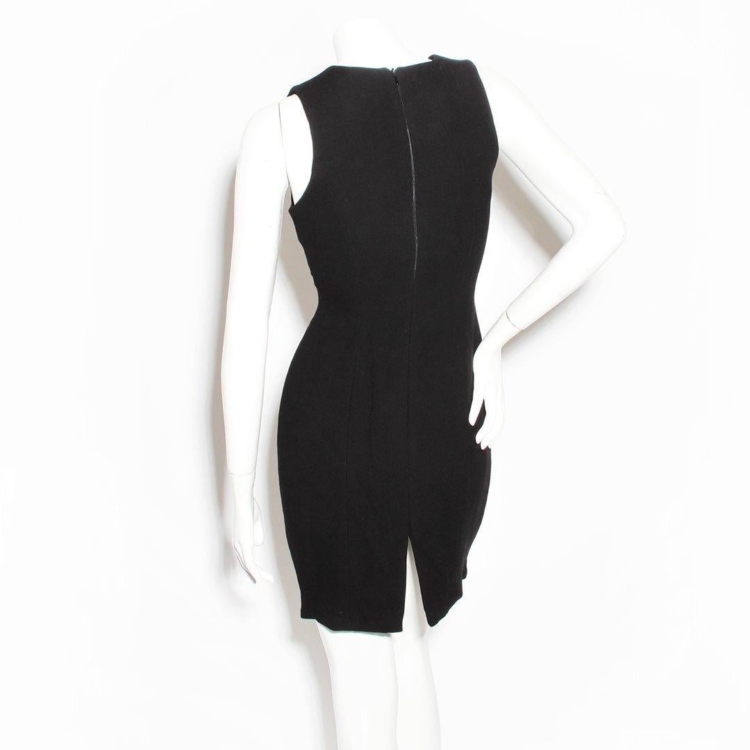 Cut Out Dress by Todd Oldham
Fall/Winter 1996 RTW
Black wool dress
Cut out waist panel 
Tie waist 
Sleeveless
Zip back closure 
Slit in back 
100% wool 
Made in The U.S.A. 
Condition: Excellent, little to zero visible wear. (see photos)