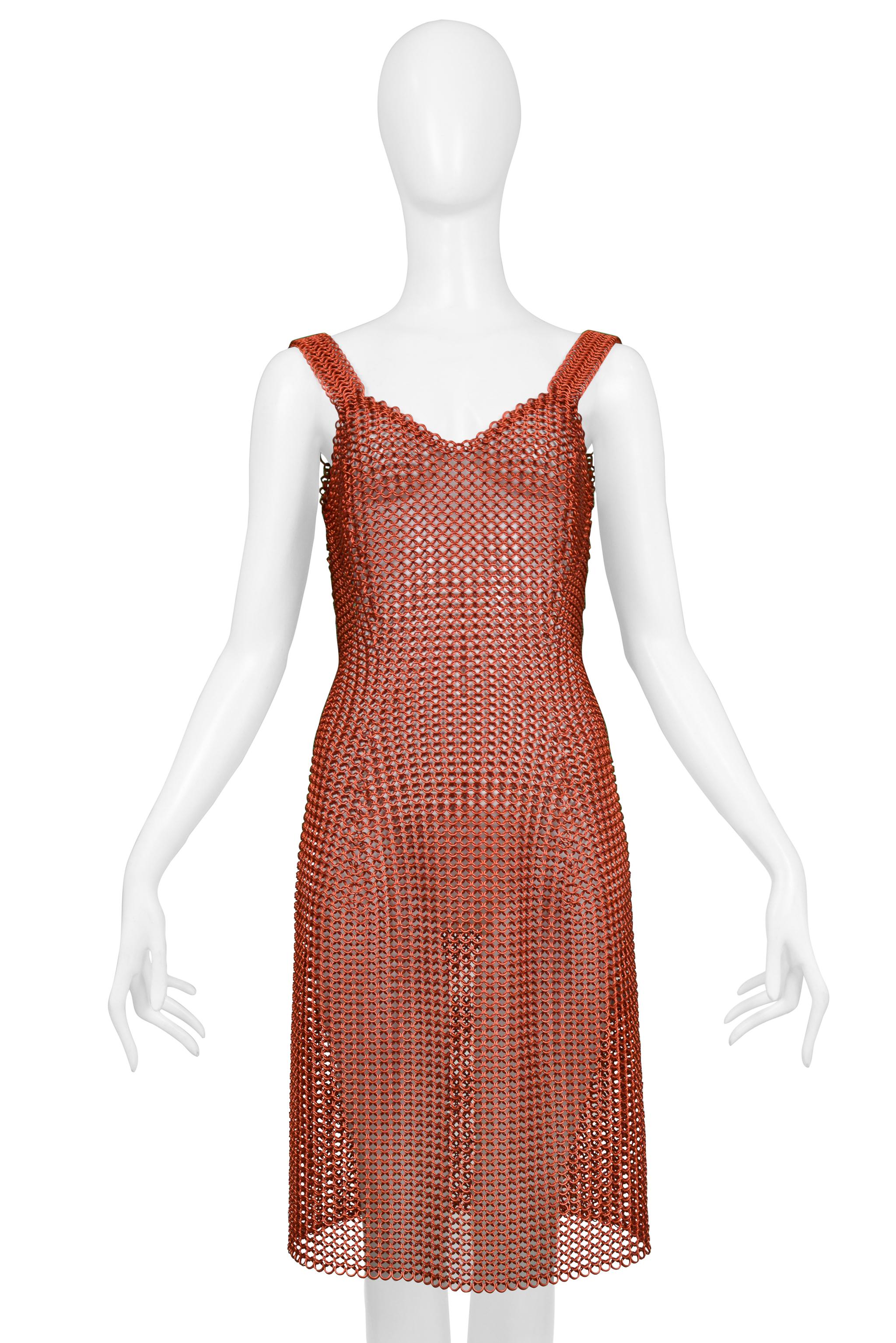 Resurrection Vintage is excited to offer a stunning vintage Todd Oldham red metal chain link dress featuring wide straps, slinky body, and above the knee length.

Todd Oldham 
Size No Label - Today's Size Small
Metal
1995 Collection 
Excellent