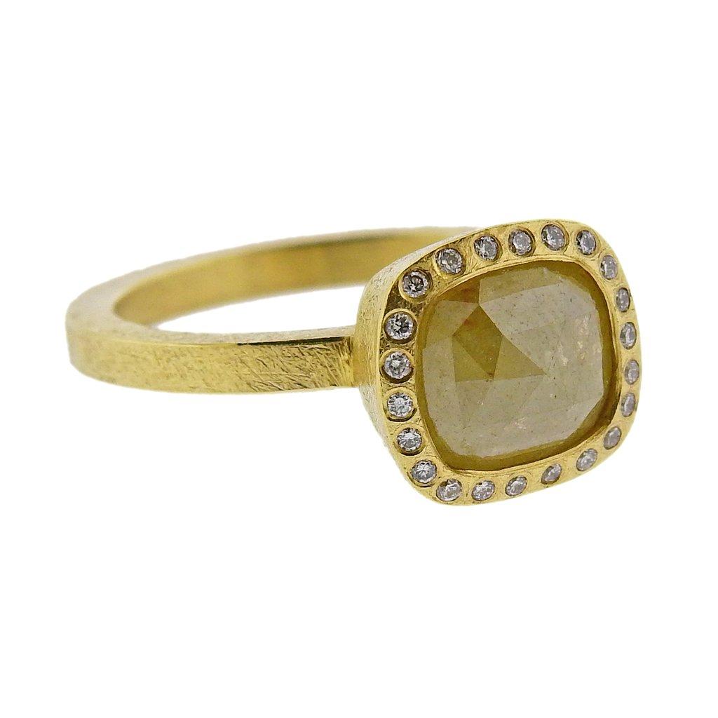 Wide 18k gold band ring by Todd Reed, set with an approx. 1.82ct rose cut rough center diamond, surrounded with approx. 0.11ctw in round brilliant diamonds. Ring size - 6.5, top - 10.3mm x 11mm. Weight is 6.8 grams. Marked T.Reed ,750. 