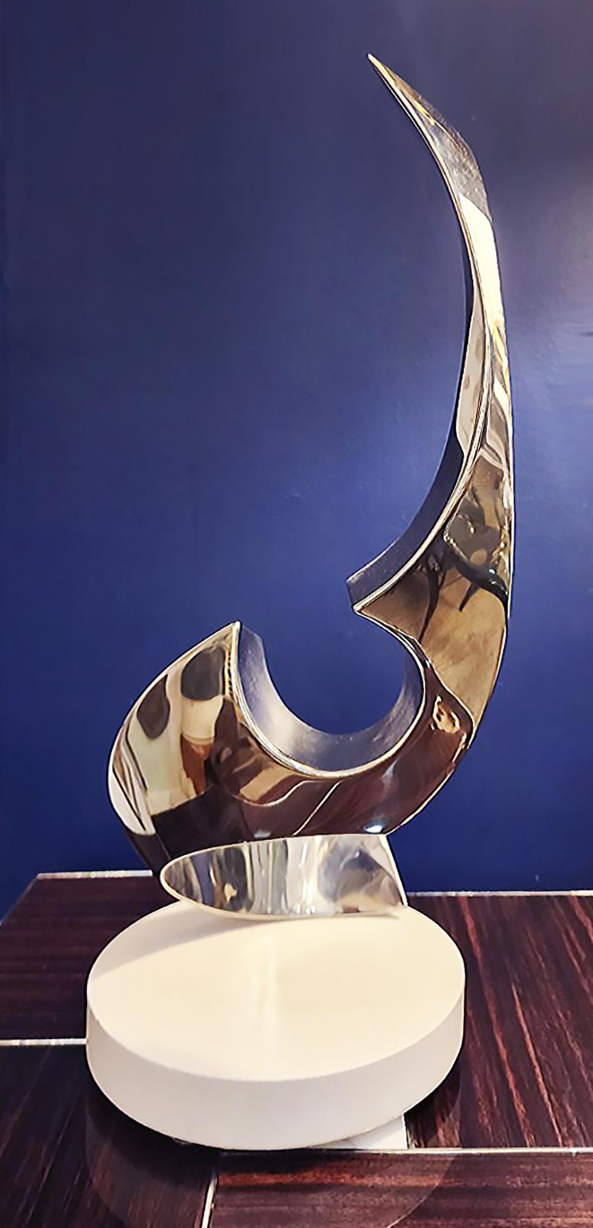 Todd Reuben chrome abstract sculpture on rotating base

Offered for sale is an original abstract sculpture by the American artist from Vermont, Todd Reuben (b. 1956), The sculpture is titled 