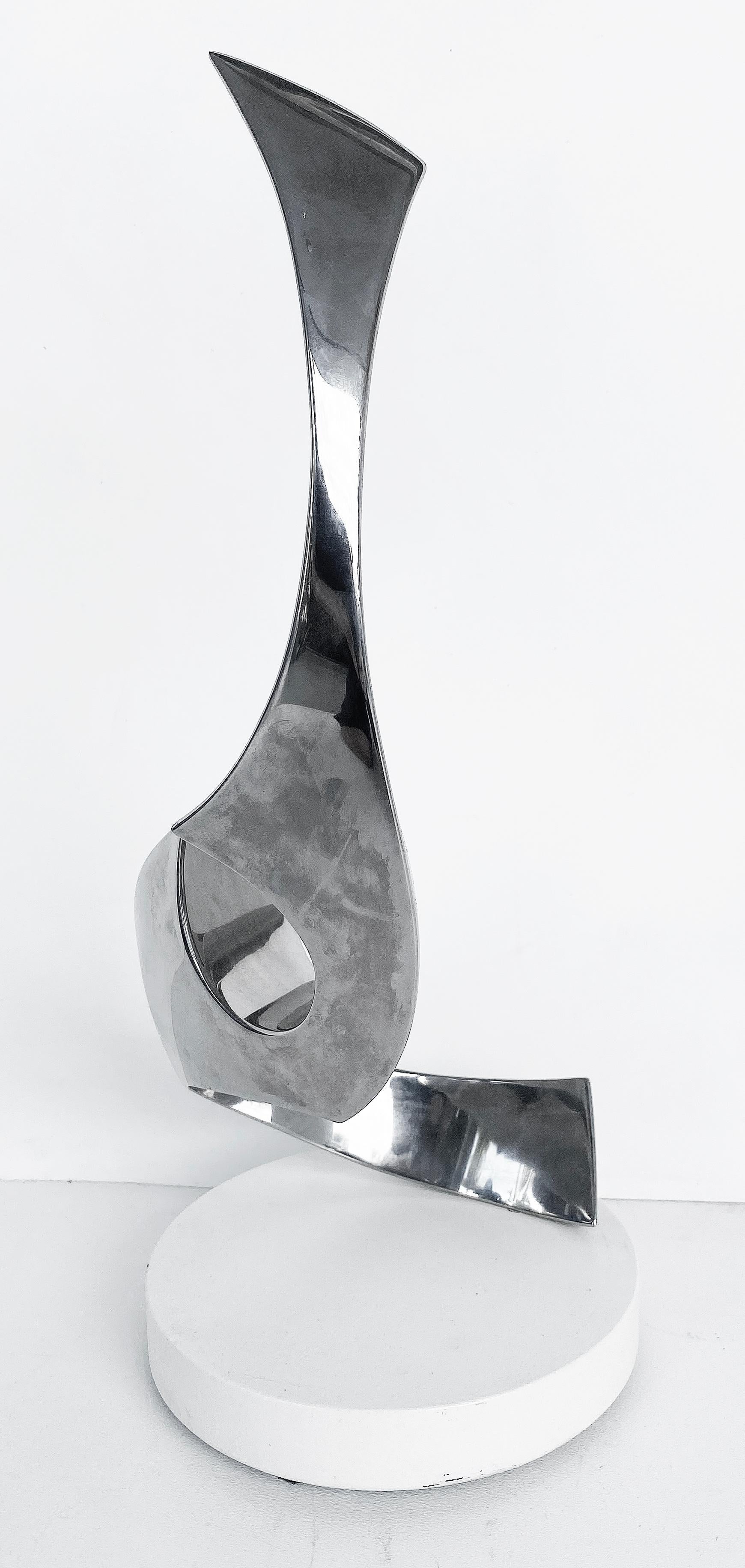 American Todd Reuben Chrome Abstract Sculpture on Rotating Base For Sale