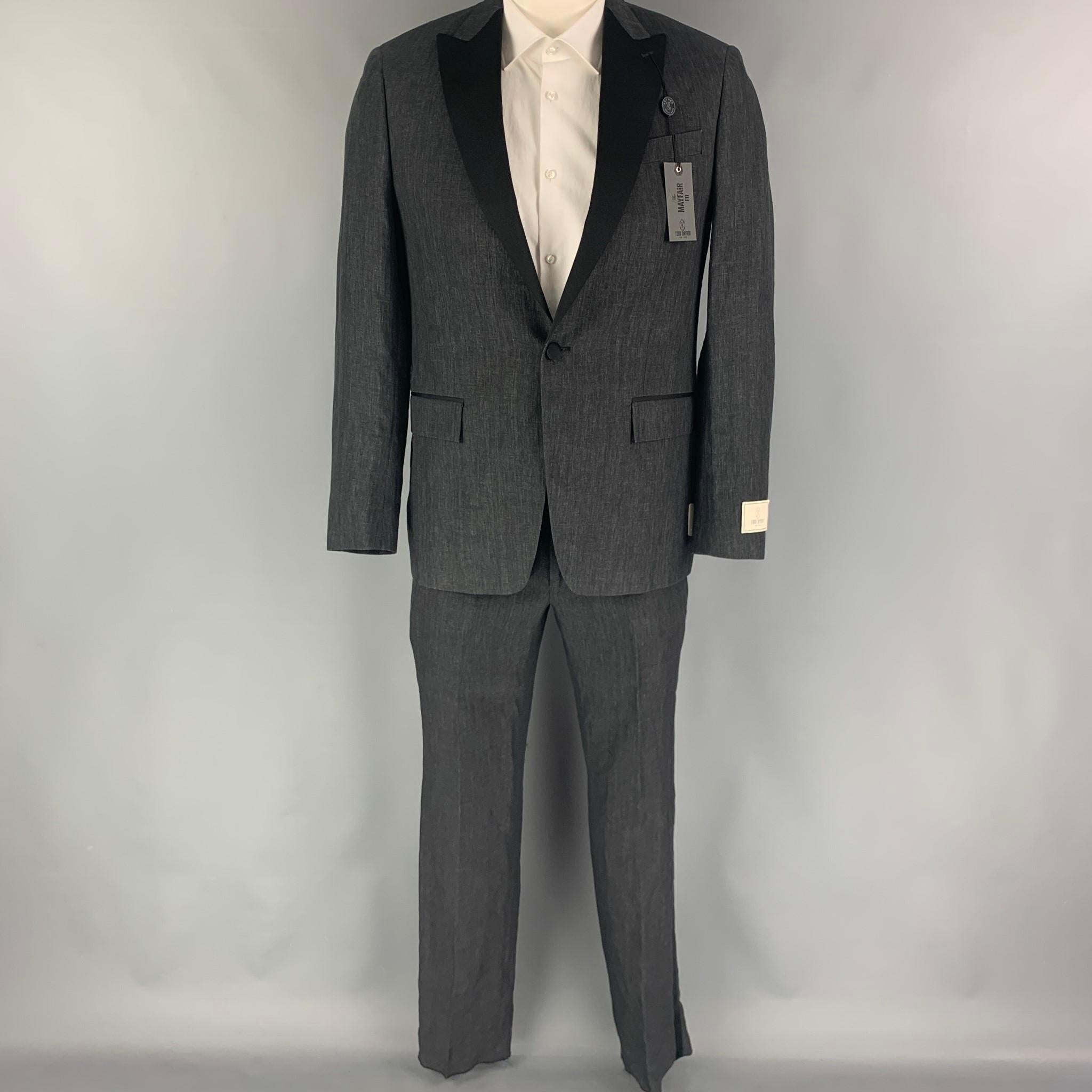 TODD SNYDER suit comes in a charcoal black linen with a full liner and includes a single breasted, single button sport coat with peak lapel and matching flat front trousers.

New with tags.
Marked: 40 R

Measurements:

-Jacket
Shoulder: 17