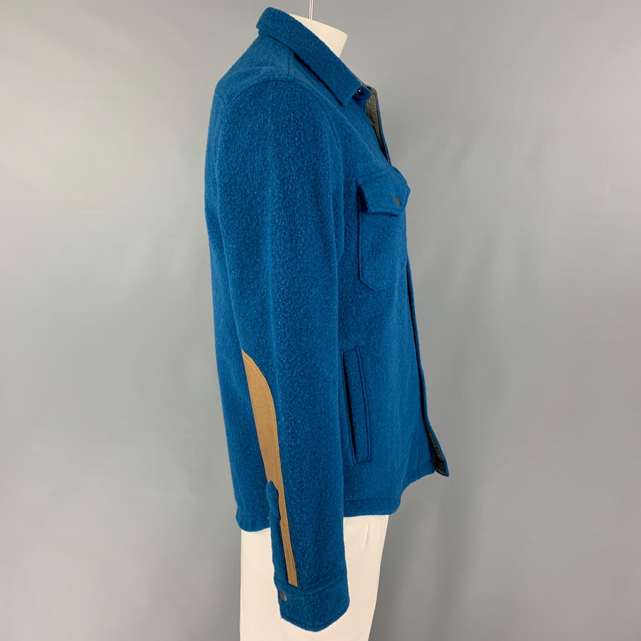 TODD SNYDER x L.L. BEAN shirt jacket comes in a teal textured wool / nylon featuring sleeve patches, front pockets, spread collar, and a snap button closure. 

Very Good Pre-Owned Condition.
Marked: M

Measurements:

Shoulder: 19 in.
Chest: 42