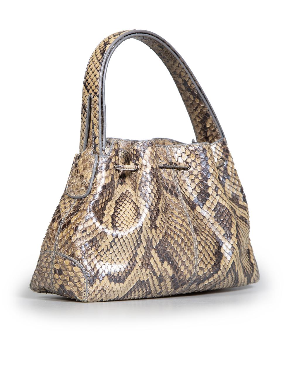 CONDITION is Very good. Minimal wear to bag is evident. Minimal wear to front bottom corners of the bag and glue residue marks on the the right corner of the bag and light signs of peeling to the snakeskin leather exterior of the bag on this used